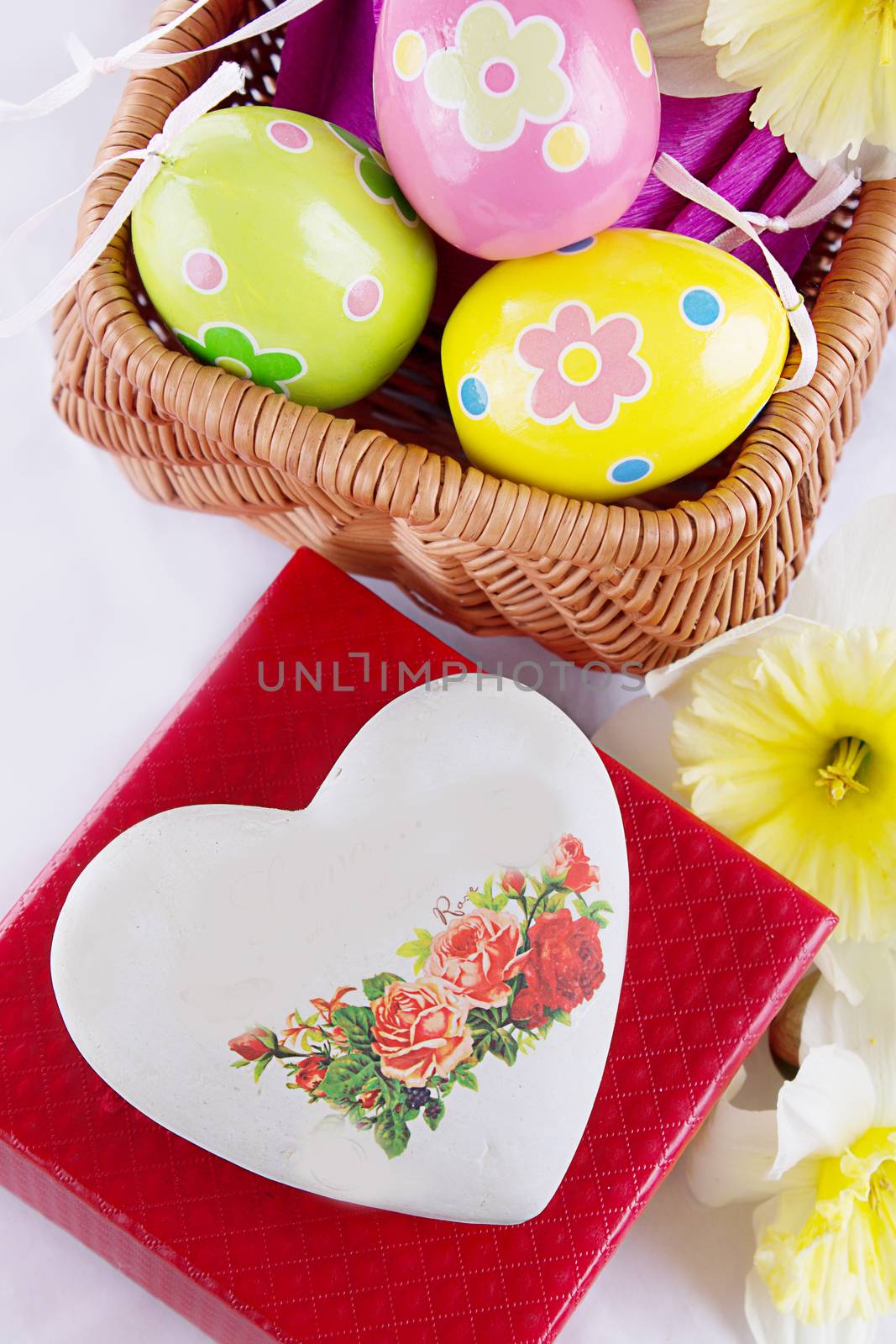 Easter decoration with eggs, flowers and heart with copy space
