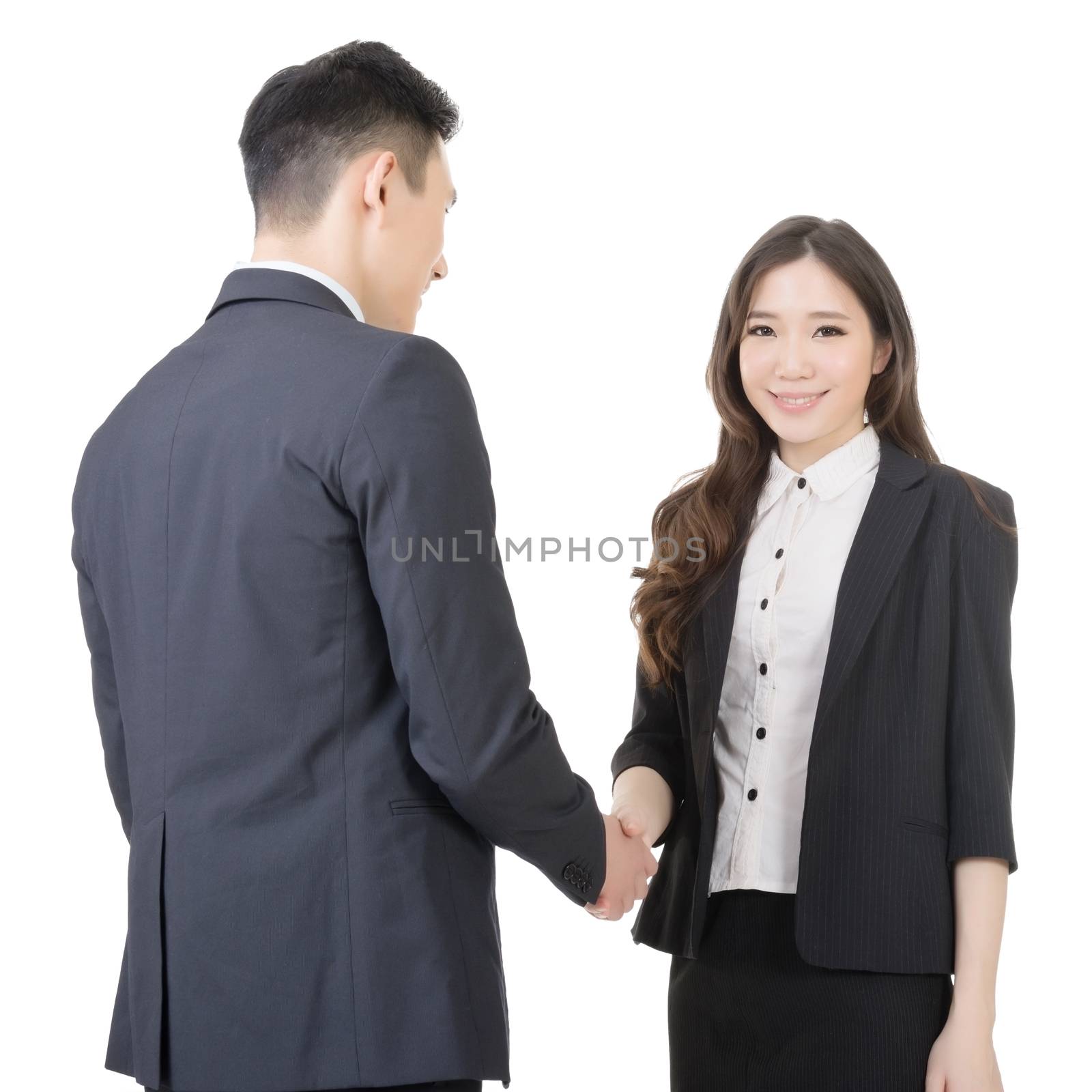 Business woman and man shake hands by elwynn