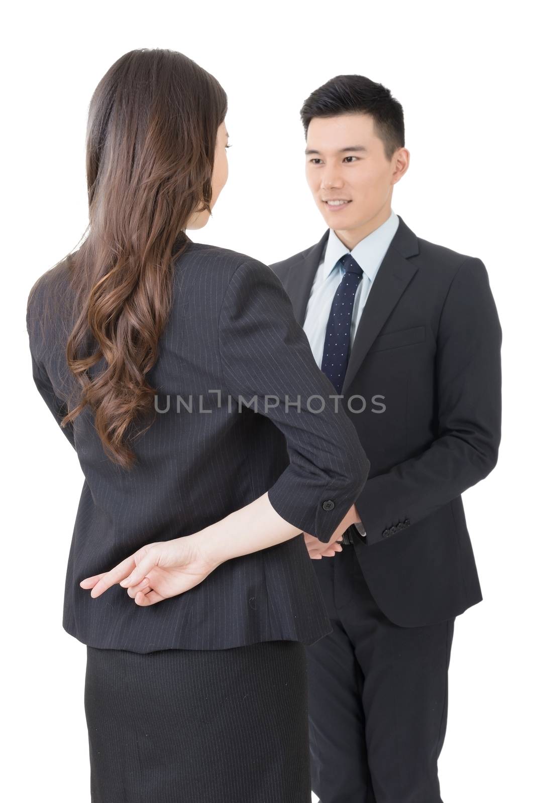 Business woman and man shake hands and put finger cross on back, closeup portrait isolated on white background.