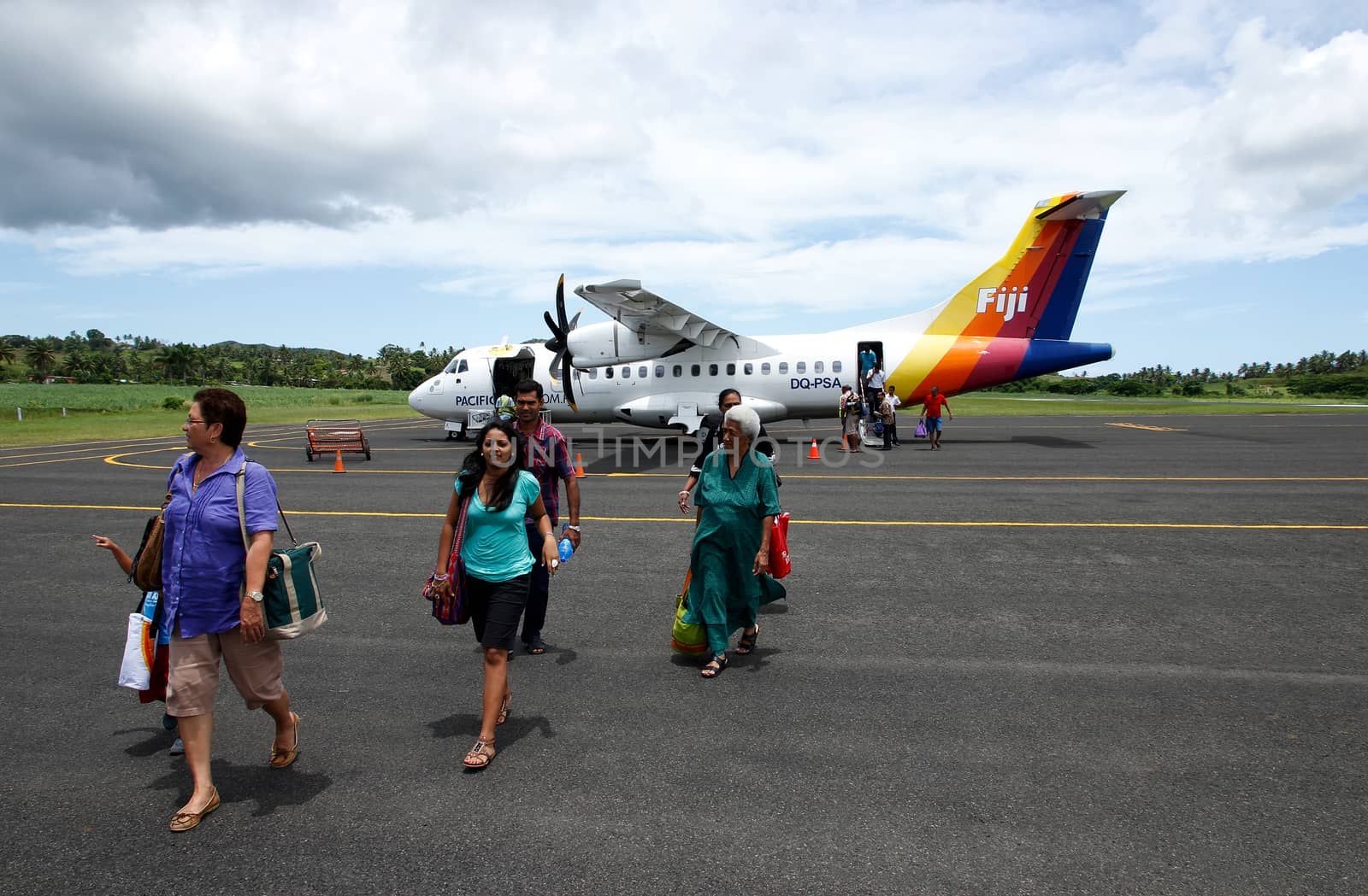 Passangers getting out of Pacific Sun airplane, Labasa airport, Vanua Levu island, Fiji, South Pacific