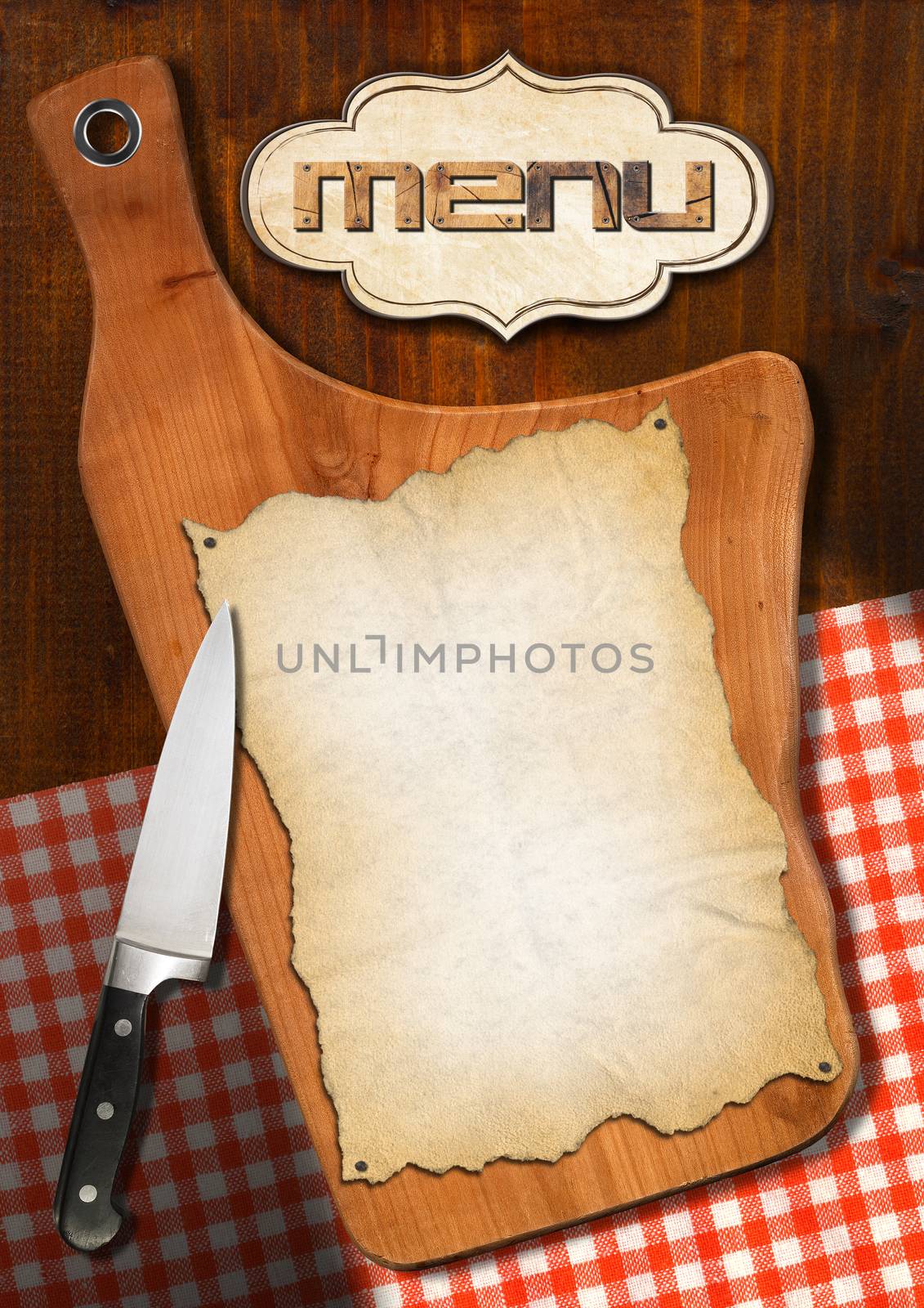 Wooden cutting board with empty parchment on white and red checked tablecloth with label and kitchen knife