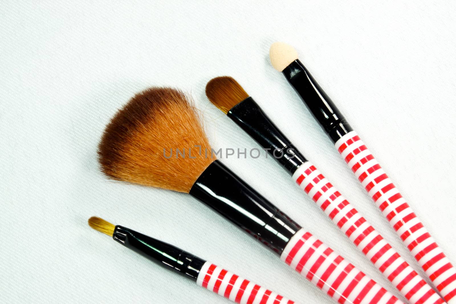 set of make up brushs on white scene,shallow focus