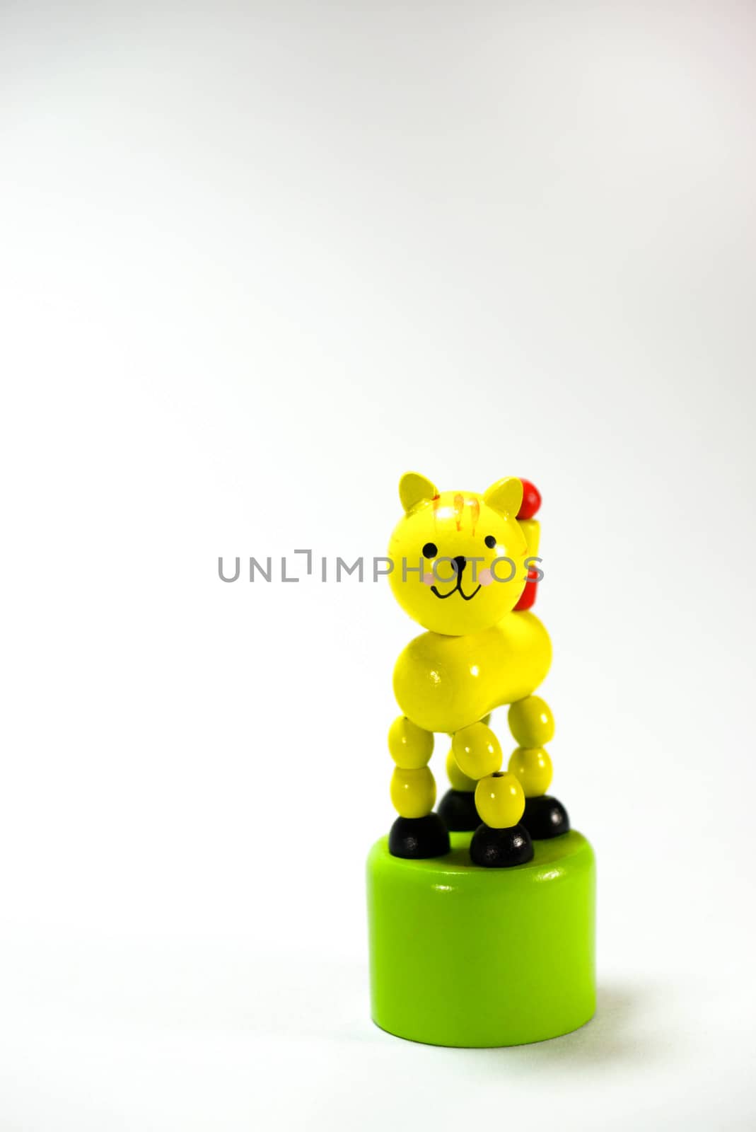 yellow wooden cat,toy on white scene