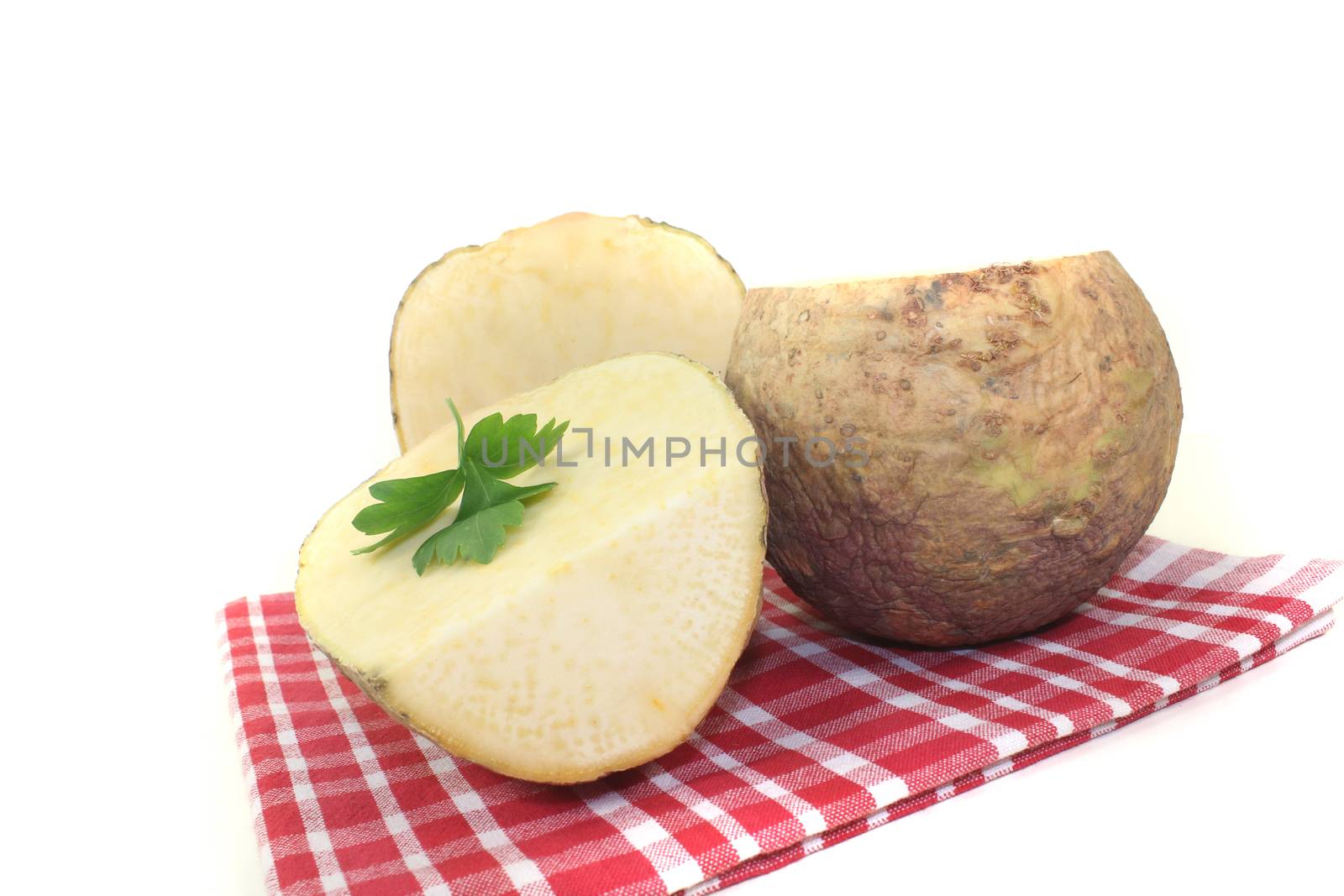rutabaga with parsley and napkin on a light background