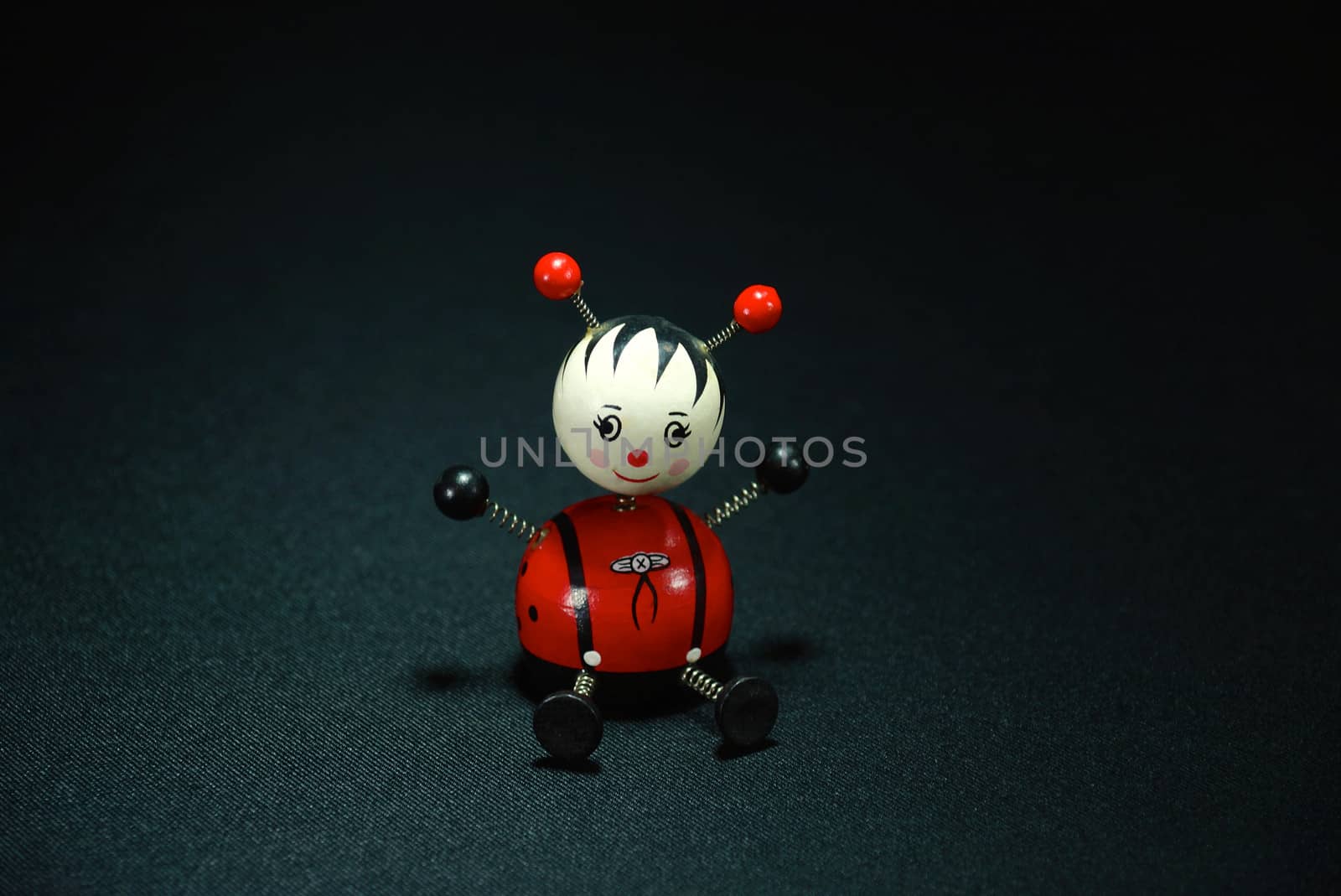 wooden doll on black scene,shallow focus