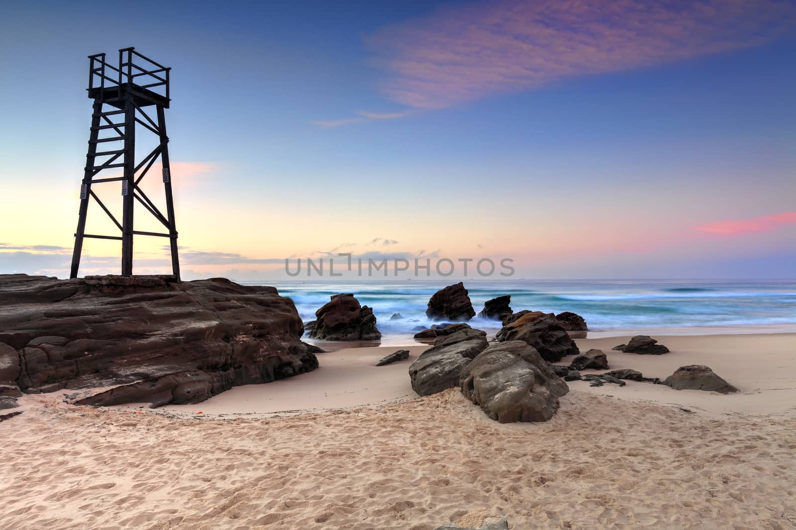 The Shark Tower and jagged rocks at Redhead Beach, NSW Australia