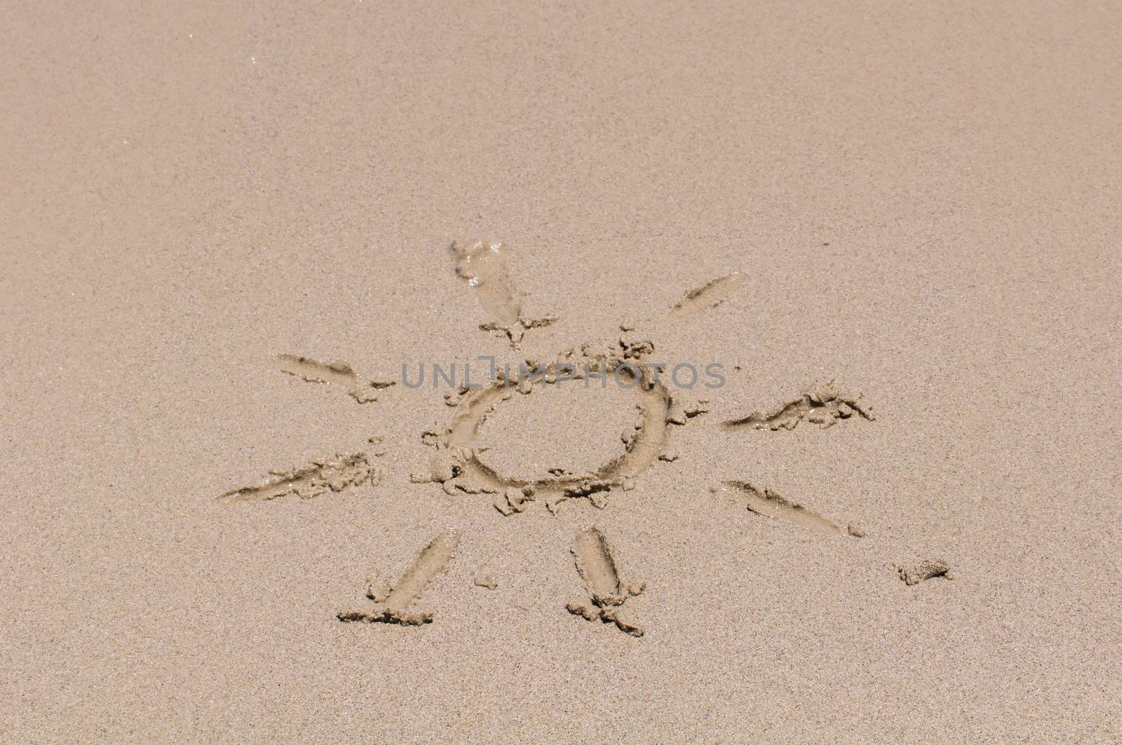 Sun drawing on sand by Sorapop