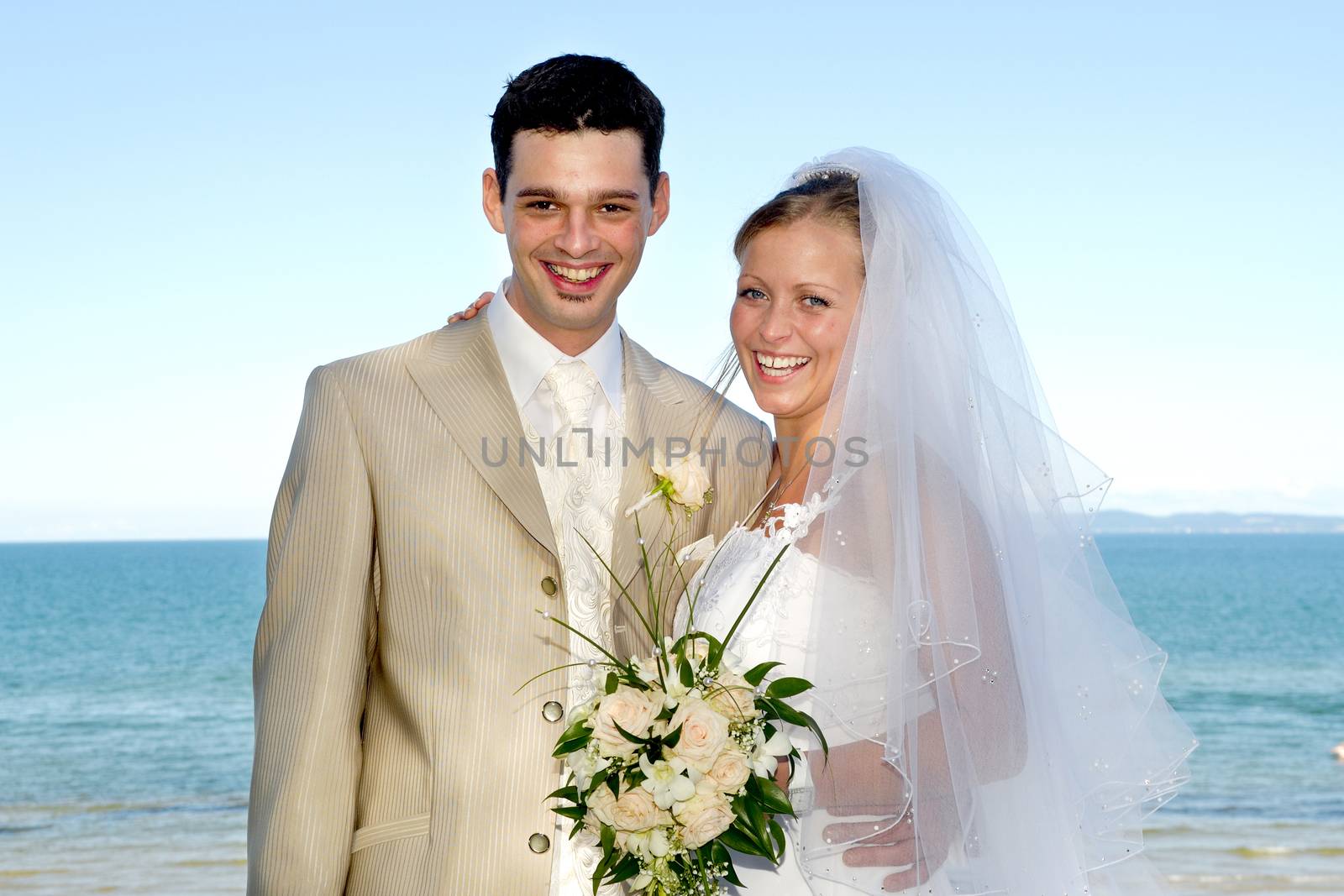 Happe wedding couple are smiling and looking
