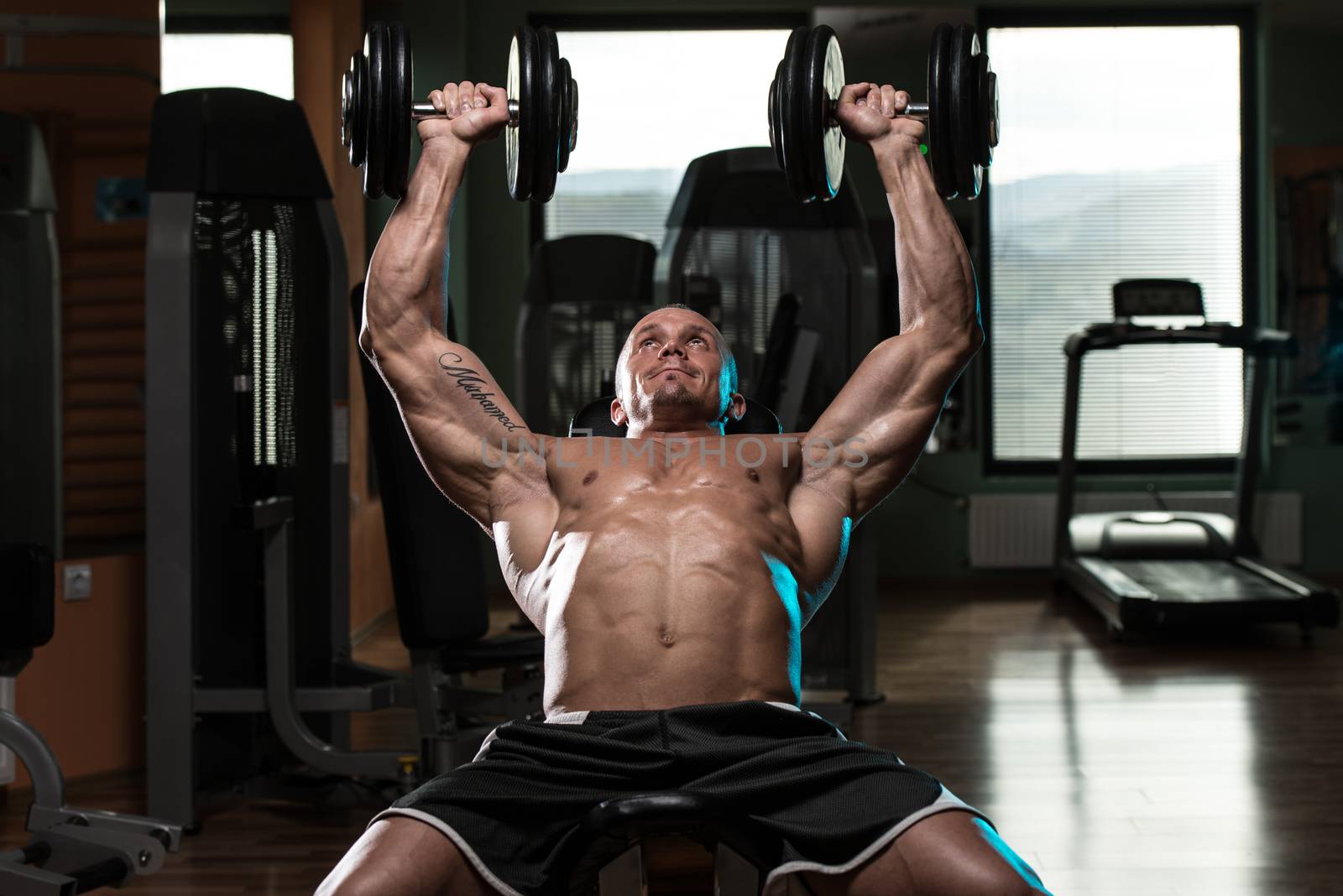 Man Doing Dumbbell Incline Bench Press Workout by JalePhoto