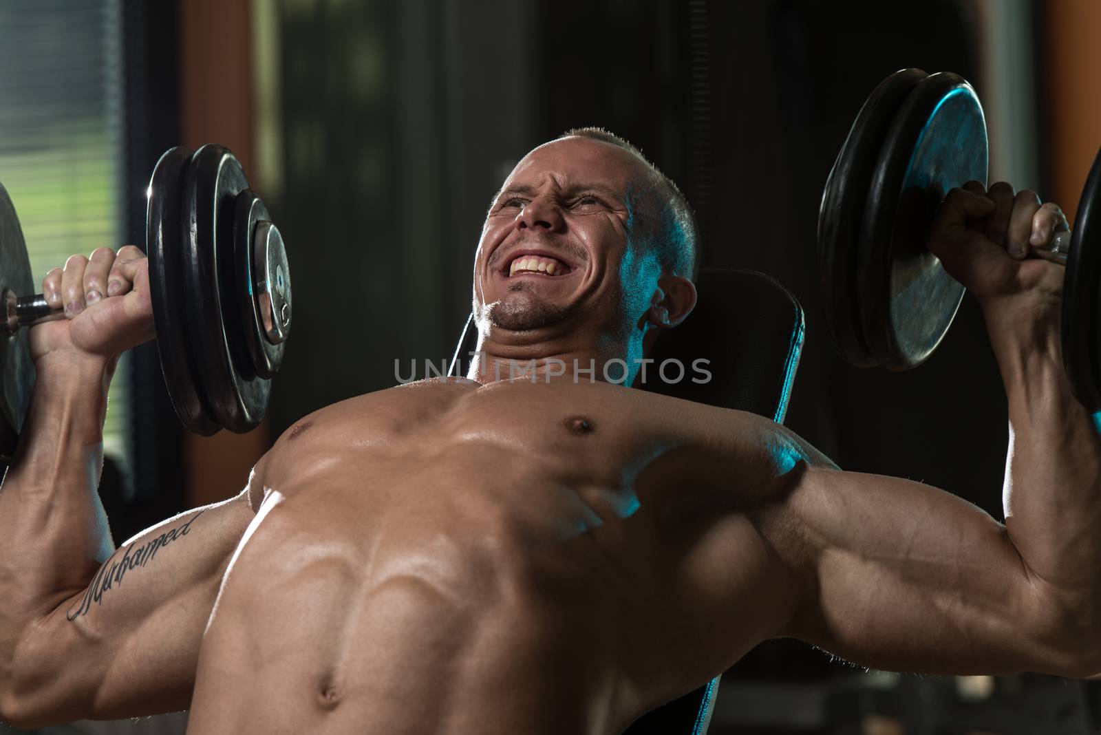 Man Doing Dumbbell Incline Bench Press Workout by JalePhoto