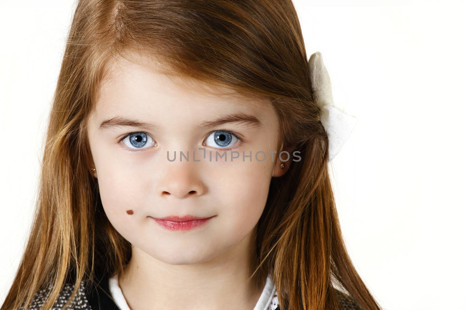 Six years old girl posing in the studio