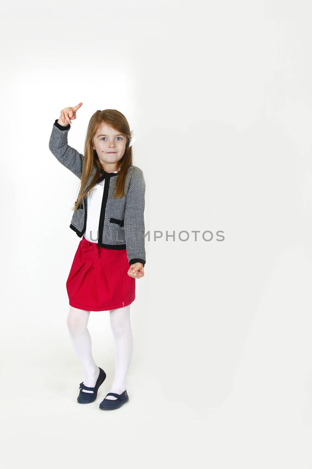 Six years old girl posing in the studio