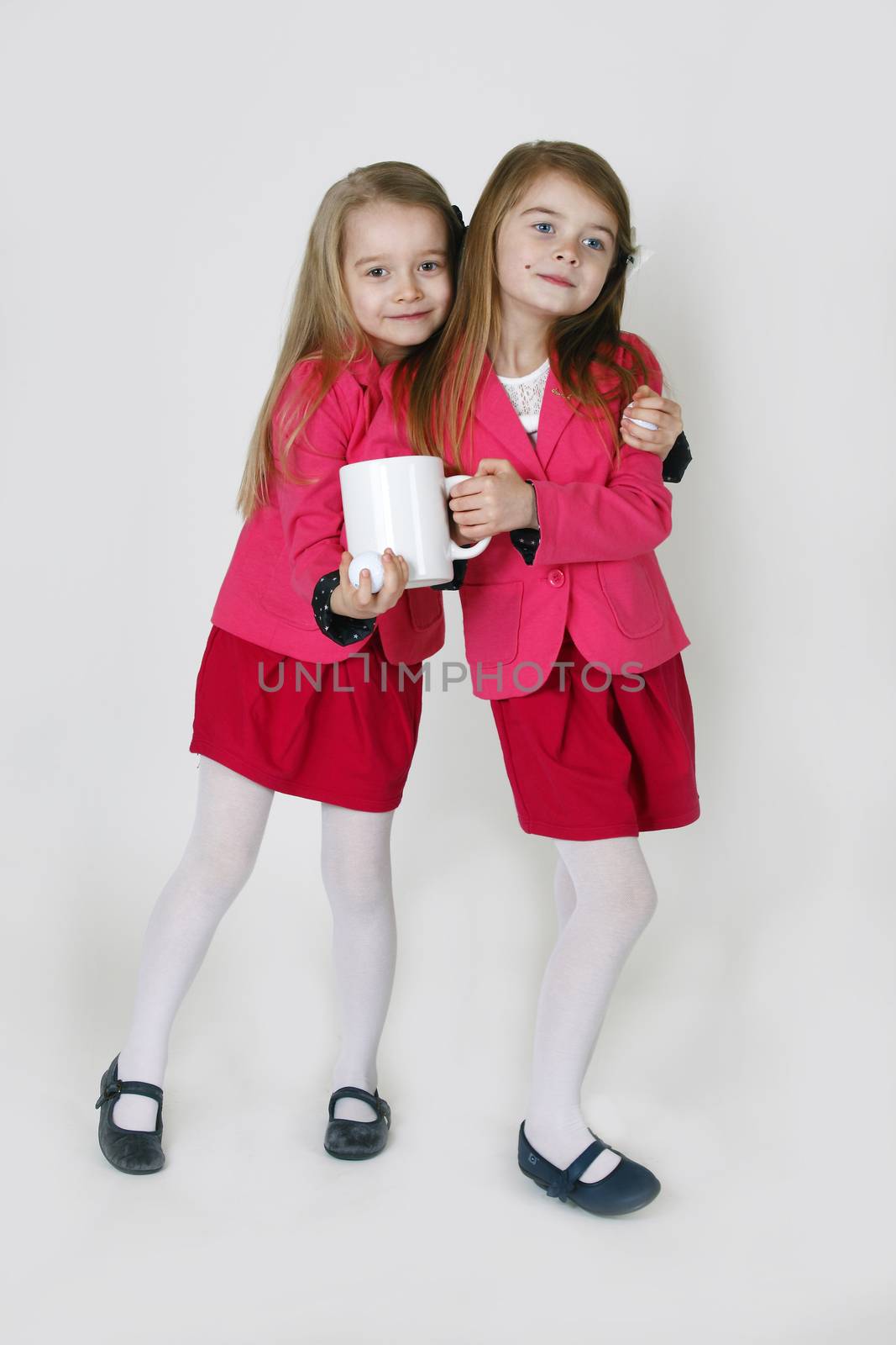 Two young girl ( sisters) in the studio