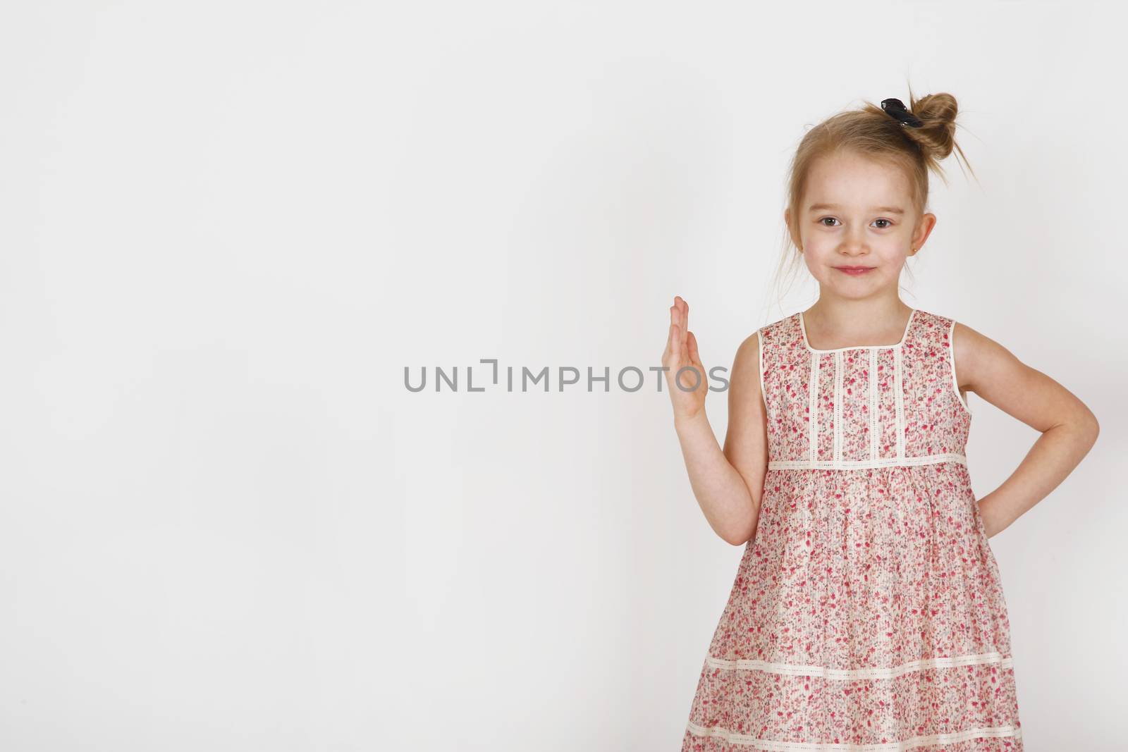 Six years old girl posing in the studio