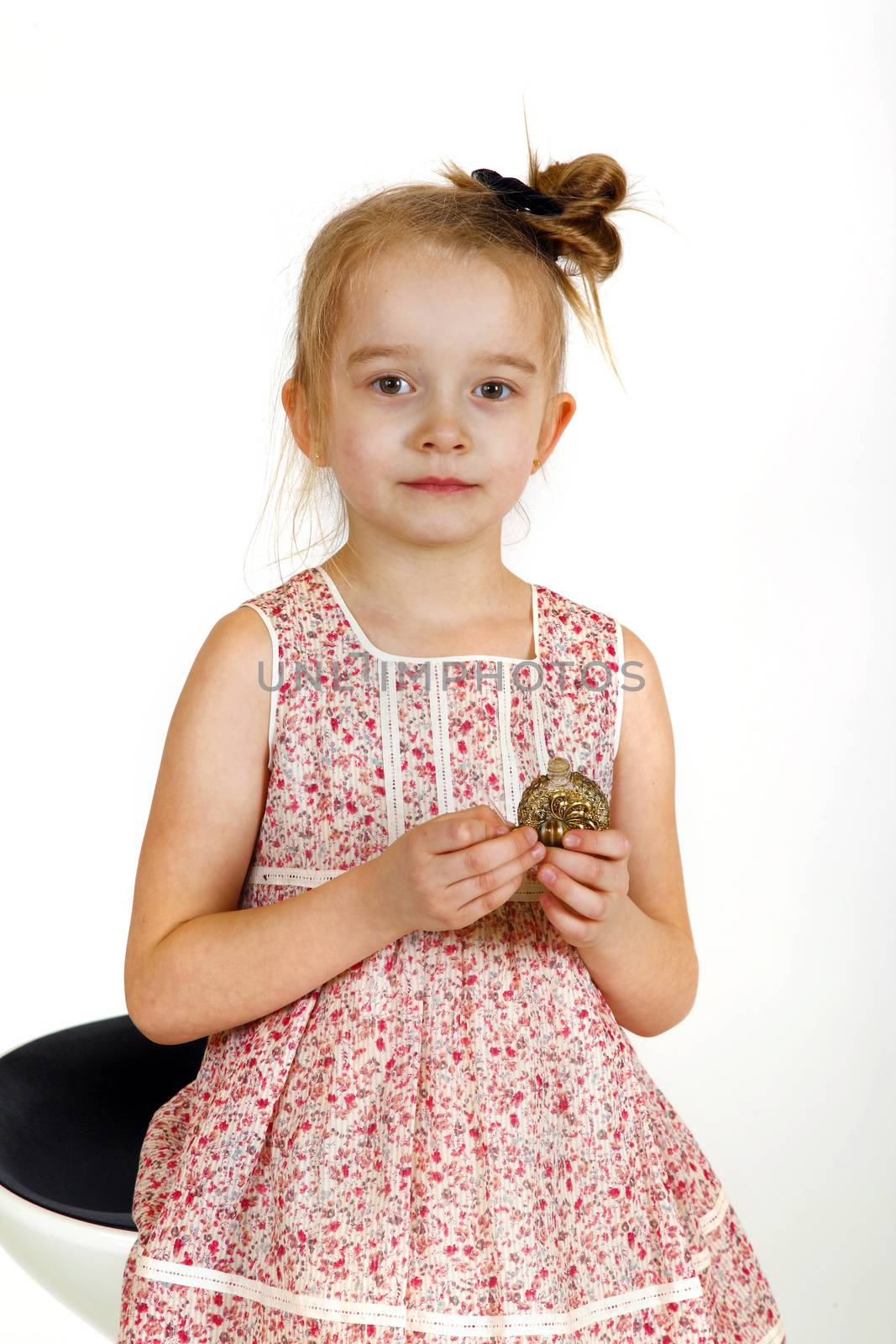 Six years old girl posing in the studio