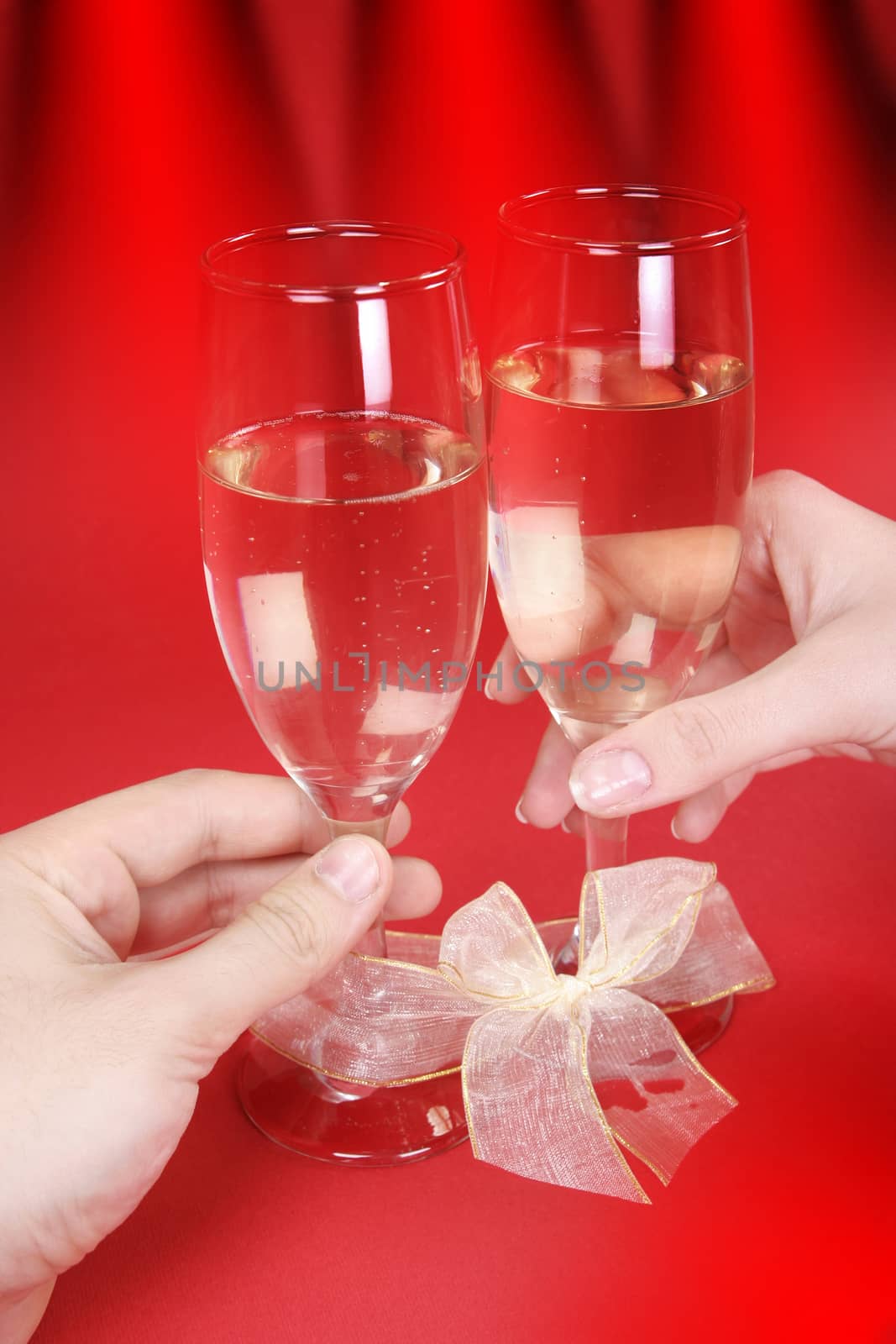 Couple celebrating valentine's day with champagne.