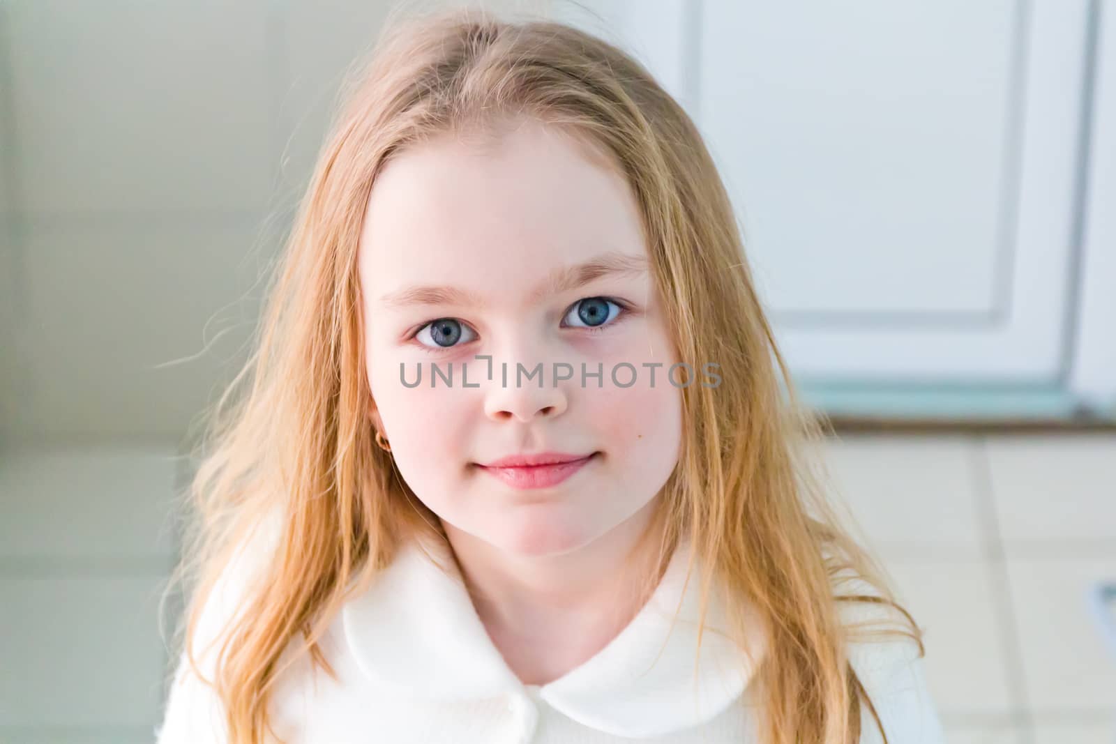 Portrait of cute girl with blond hair