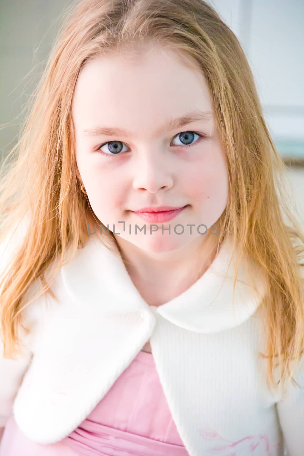 Portrait of cute girl with blond hair