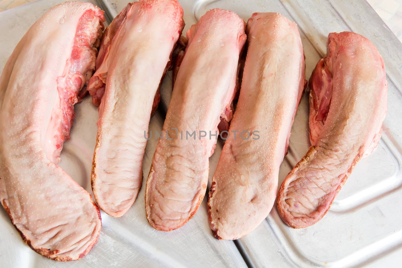 Photo of raw pork tongue in the market place