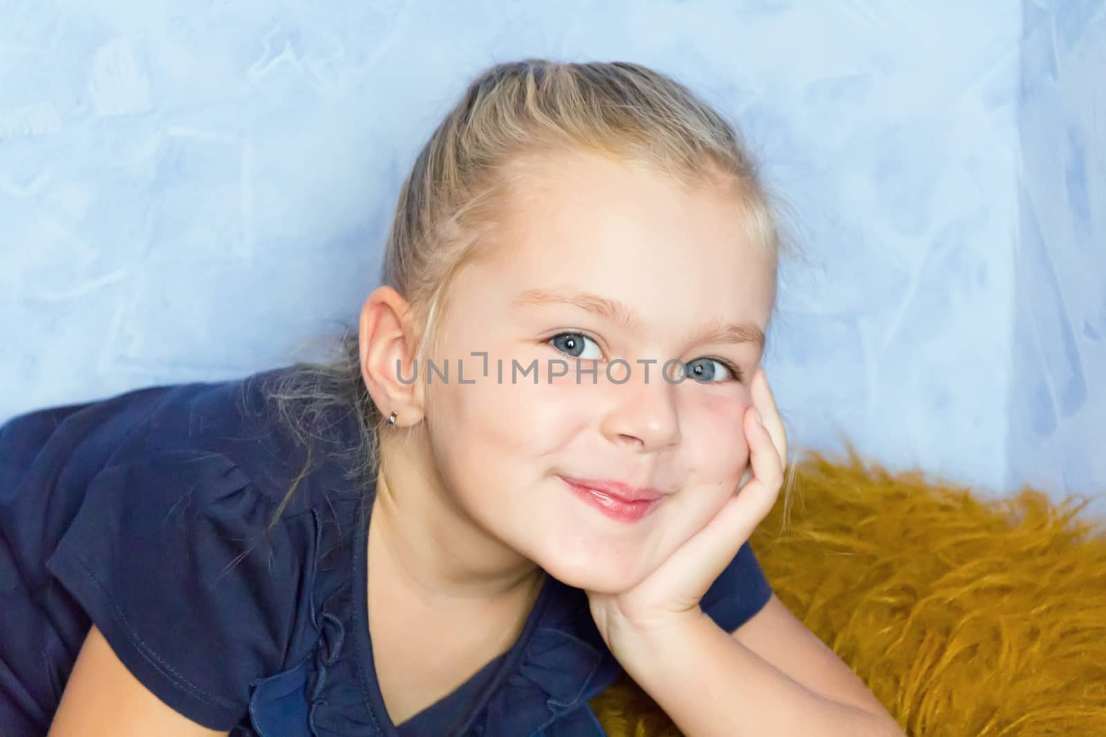 Portrait of cute girl with blond hair