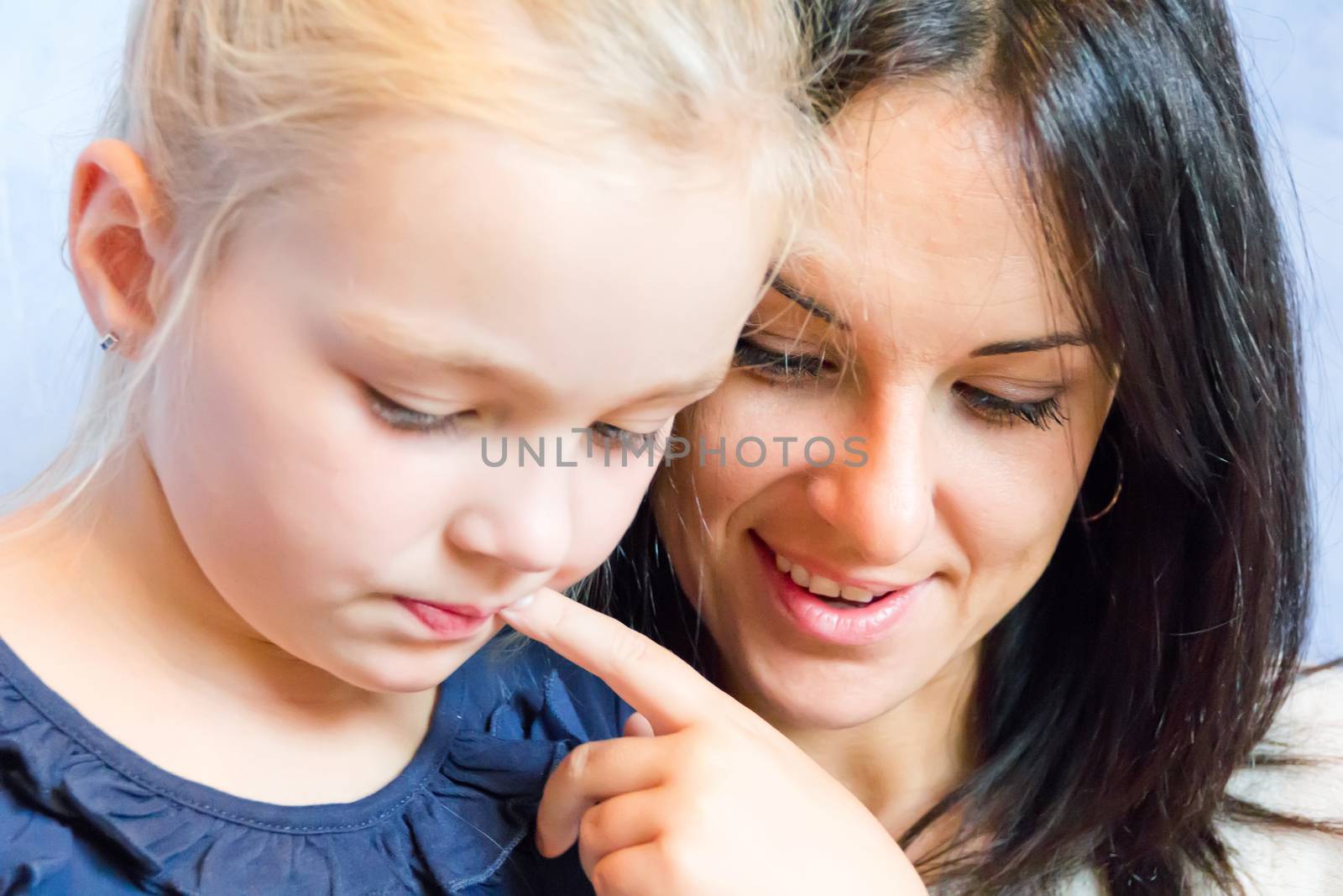 Photo of thinking mother and daughter