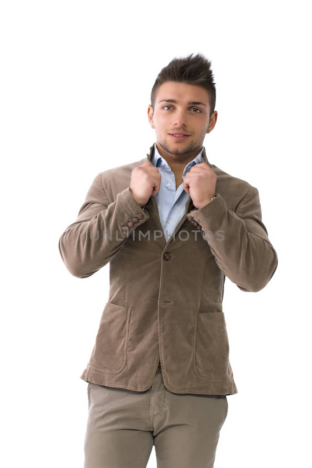 Handsome young man with winter jacket, isolated on white, holding shirt neck
