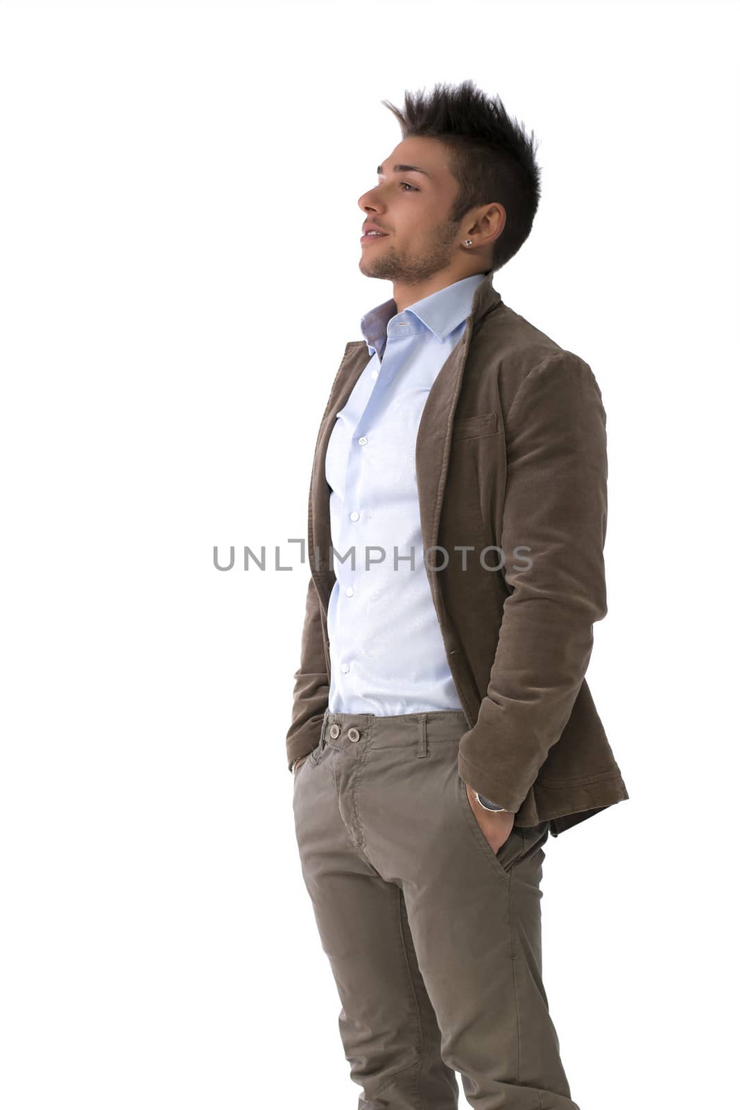 Handsome young man portrait, standing isolated on white, profile position