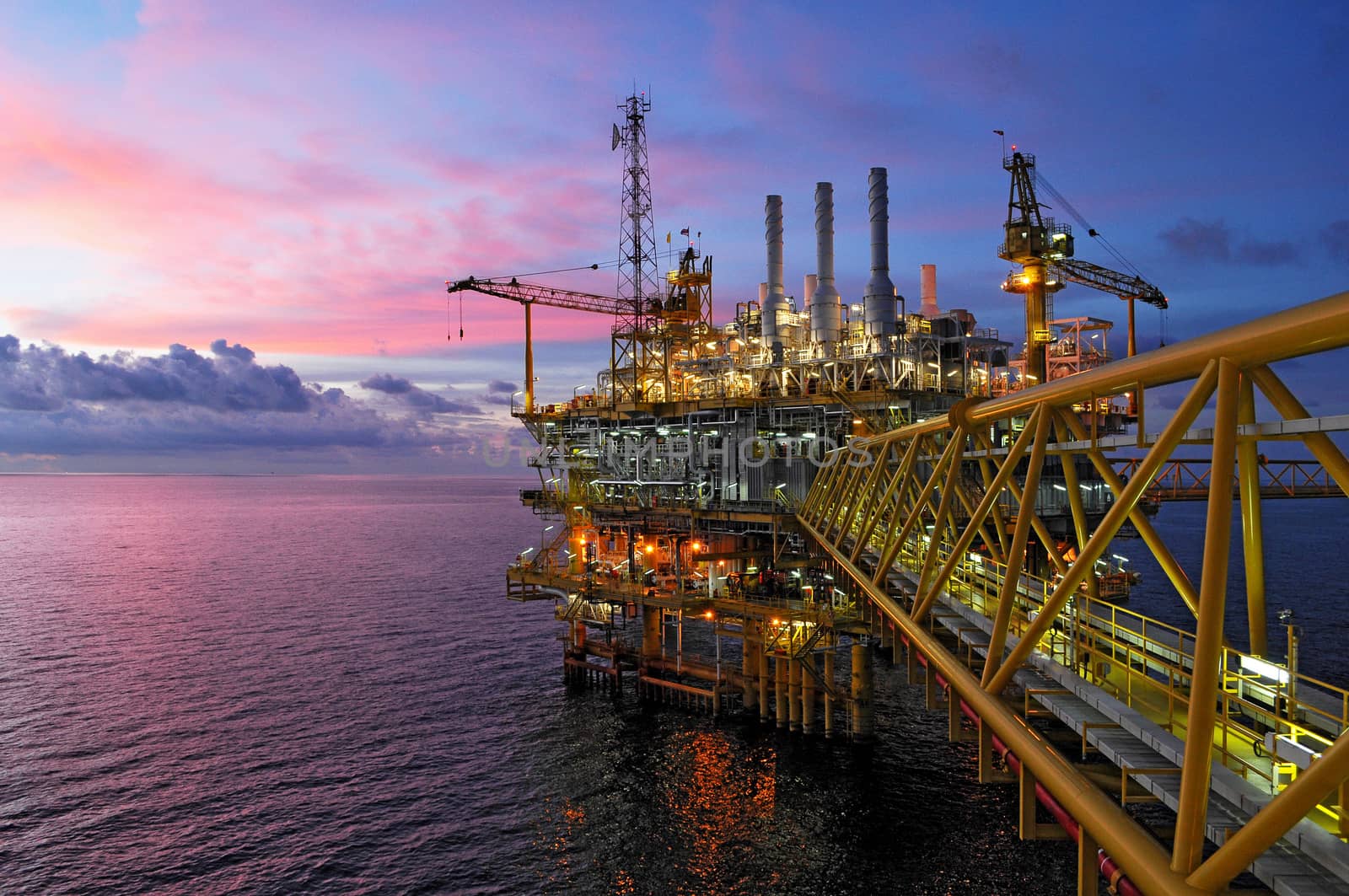 offshore rig in twilight by think4photop