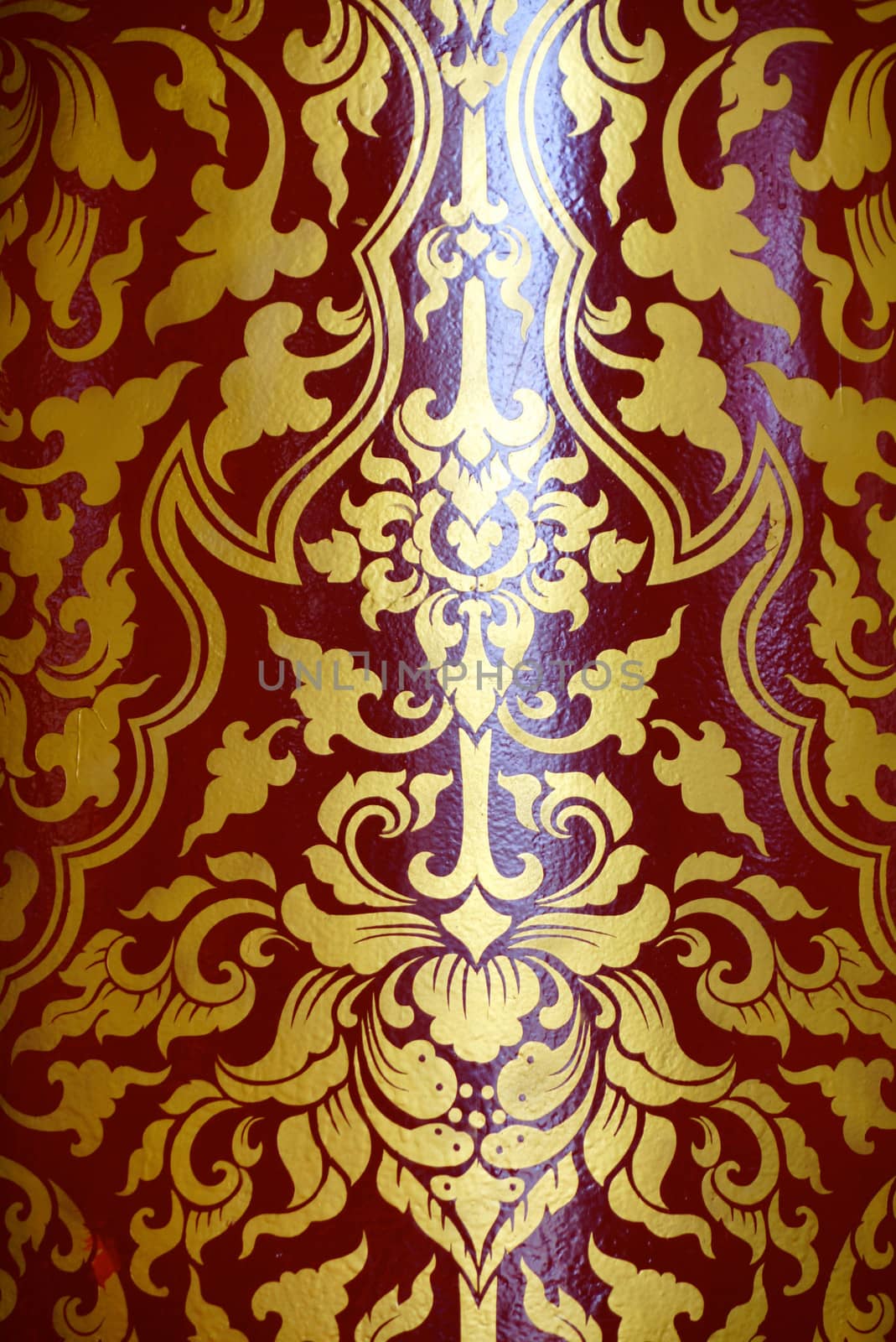 the detail of  thai style gold painting on temple pillars for decoration,shallow focus