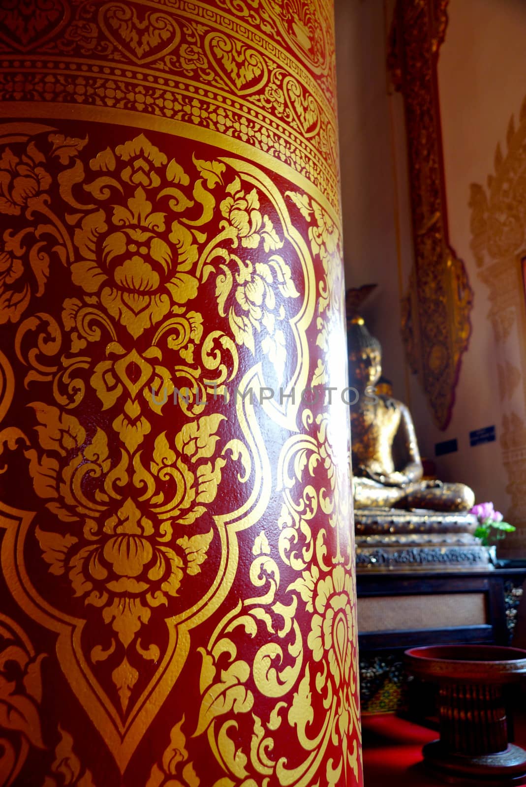 the detail of  thai style gold painting on temple pillars for decoration,shallow focus