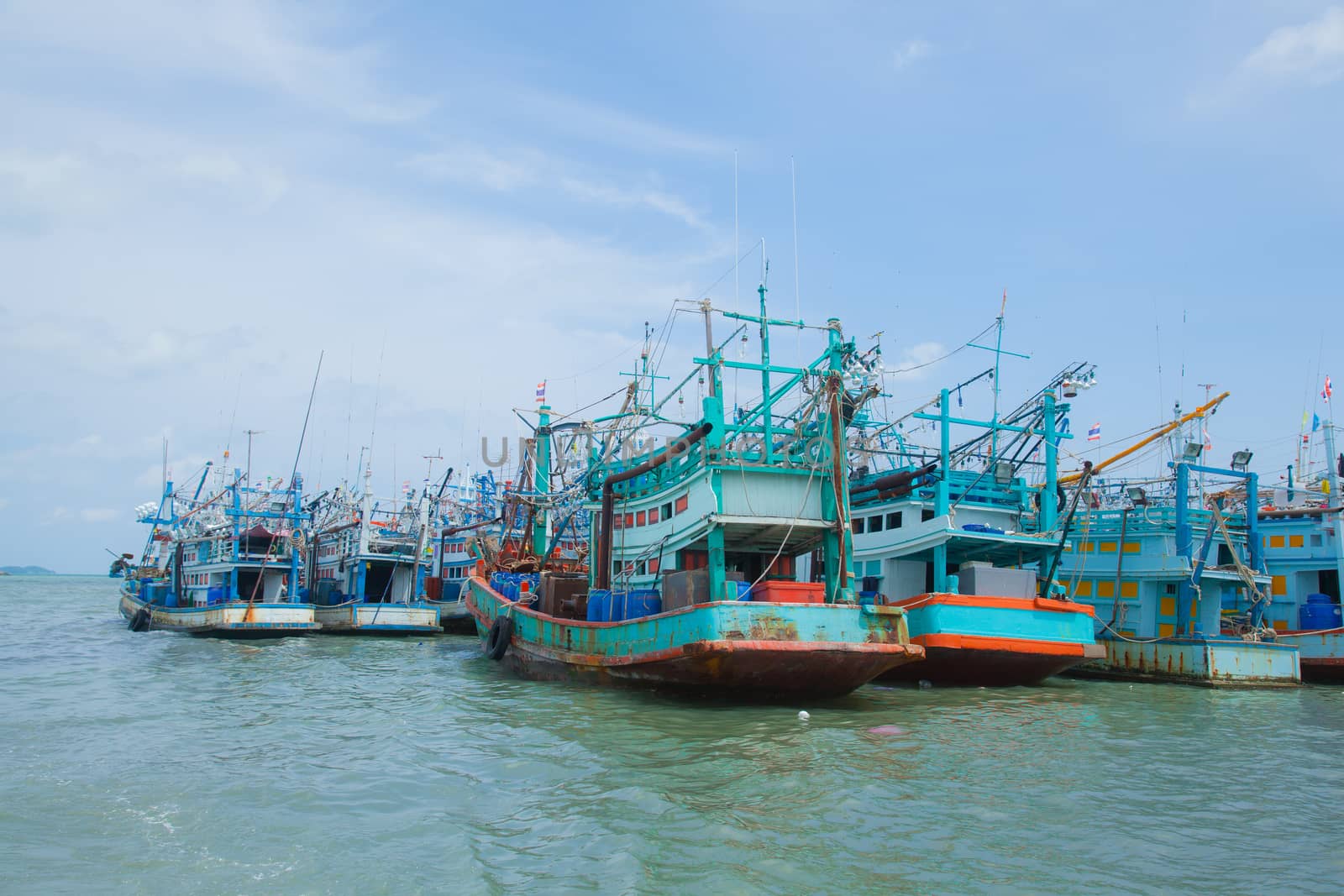 Fishing boats moored alongside the pier are a number of coastal areas.
