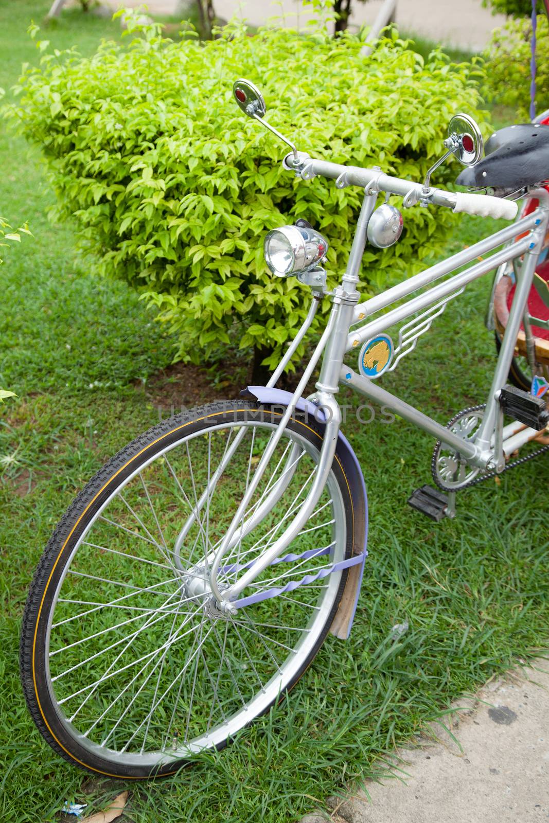 Bike has lights on the front. Bike with larger wheels are unique.