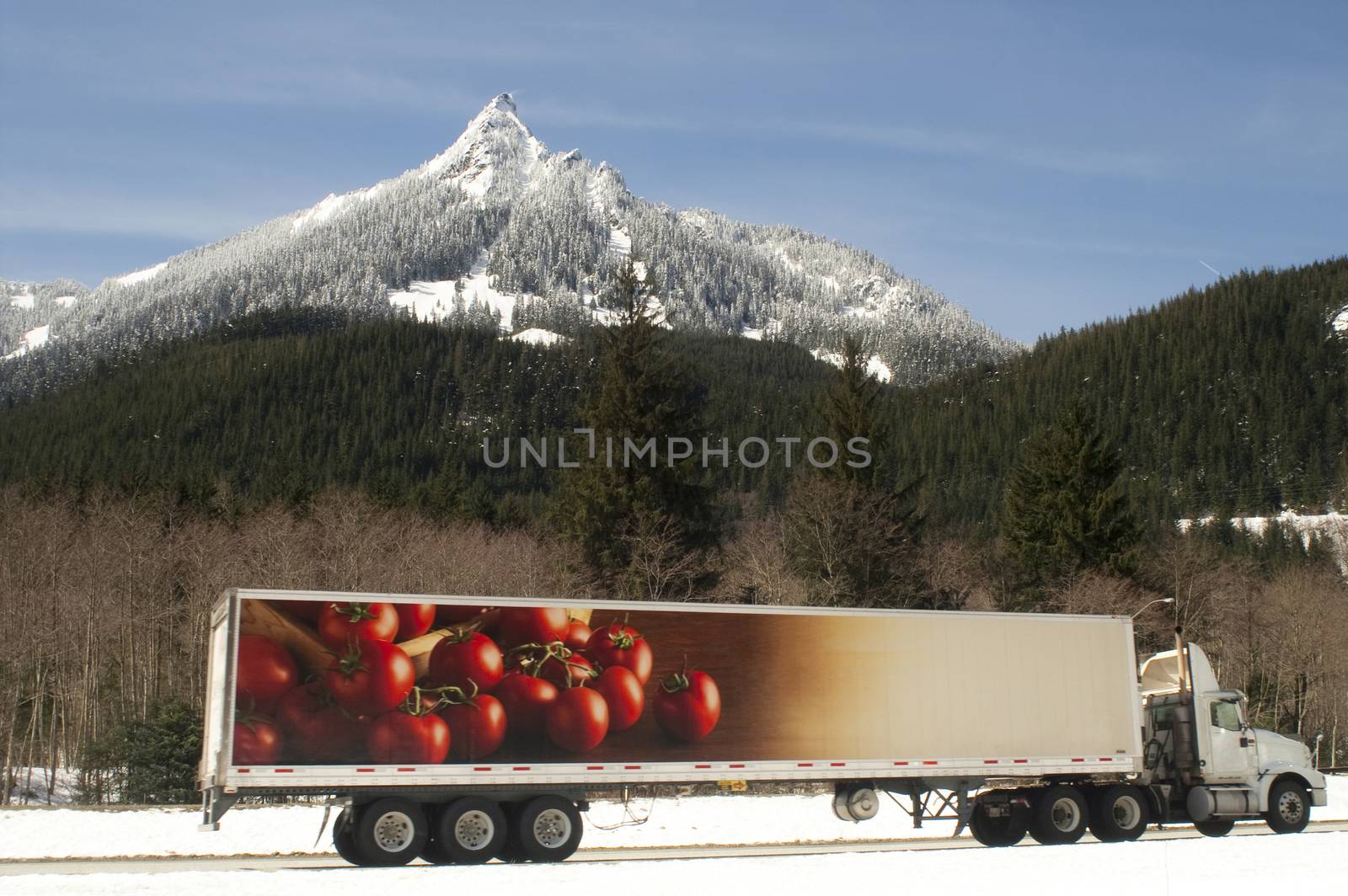 A fresh covering of snow blankets mountains over the pass on I-90