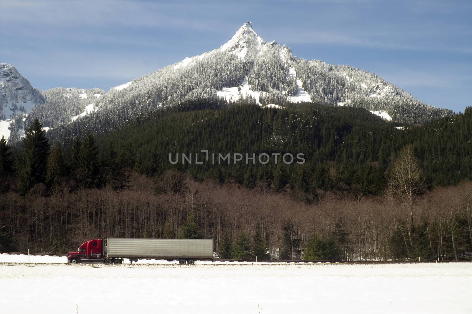 A fresh covering of snow blankets mountains over the pass on I-90