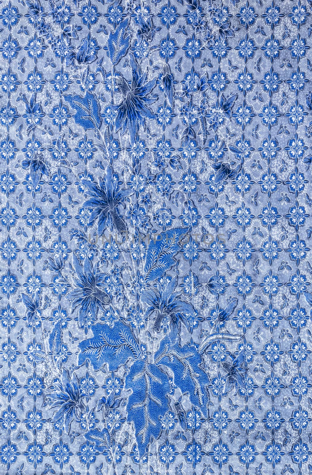Blue flowers and laef on fabric pattern background