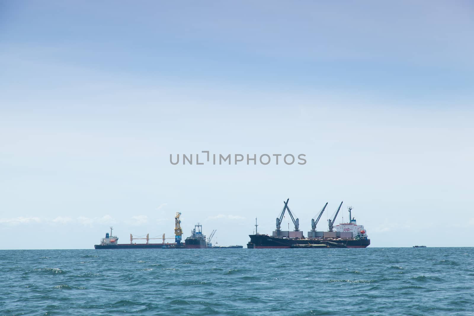 large cargo ship. Moored offshore. Transport near the docks.