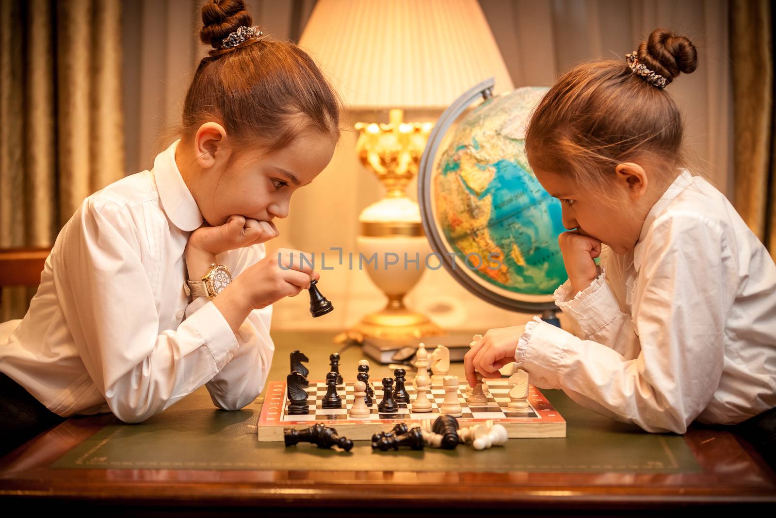 Sisters playing chess by Kryzhov