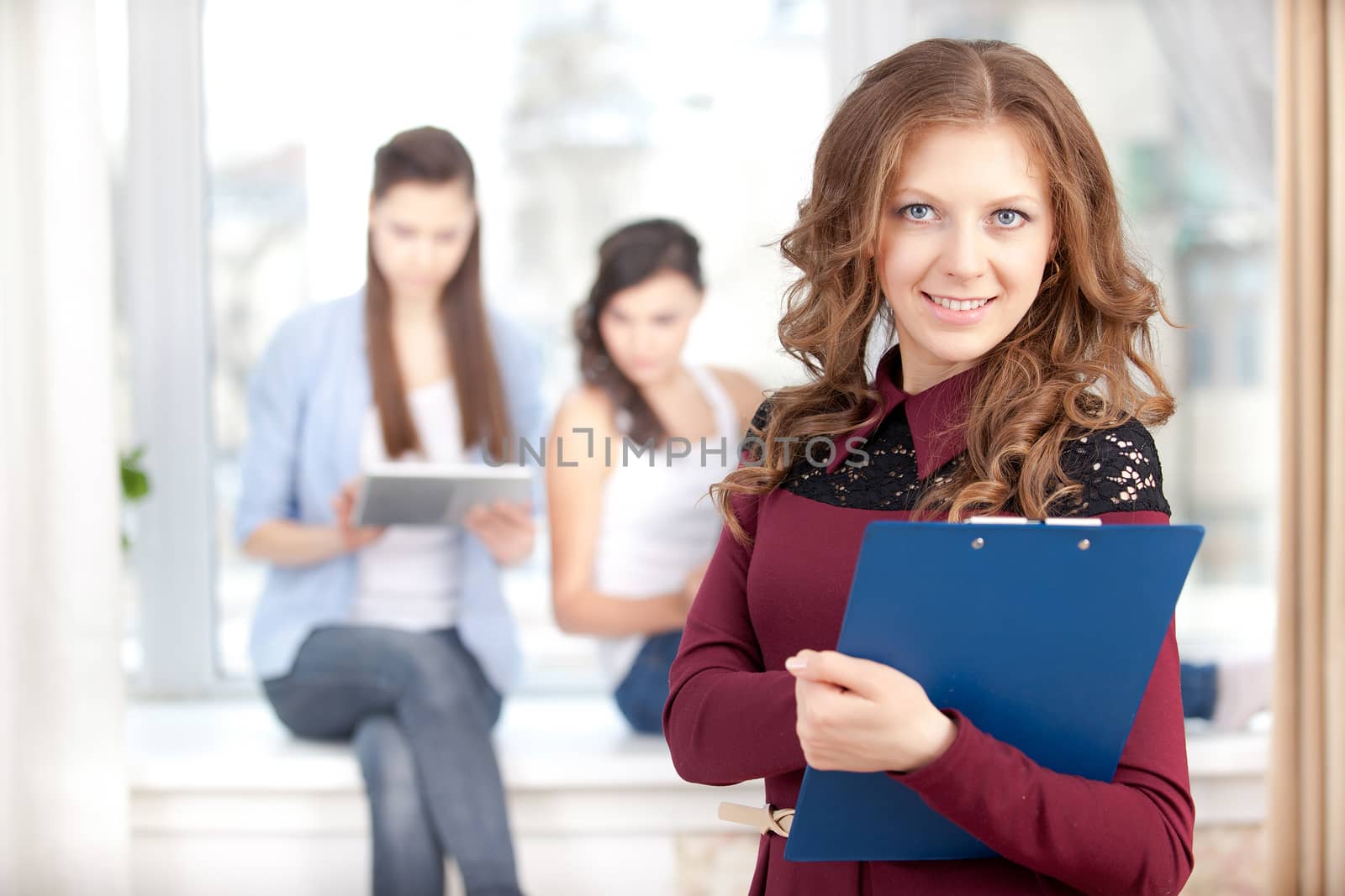 Portrait of smiling  girl looking at camera in college