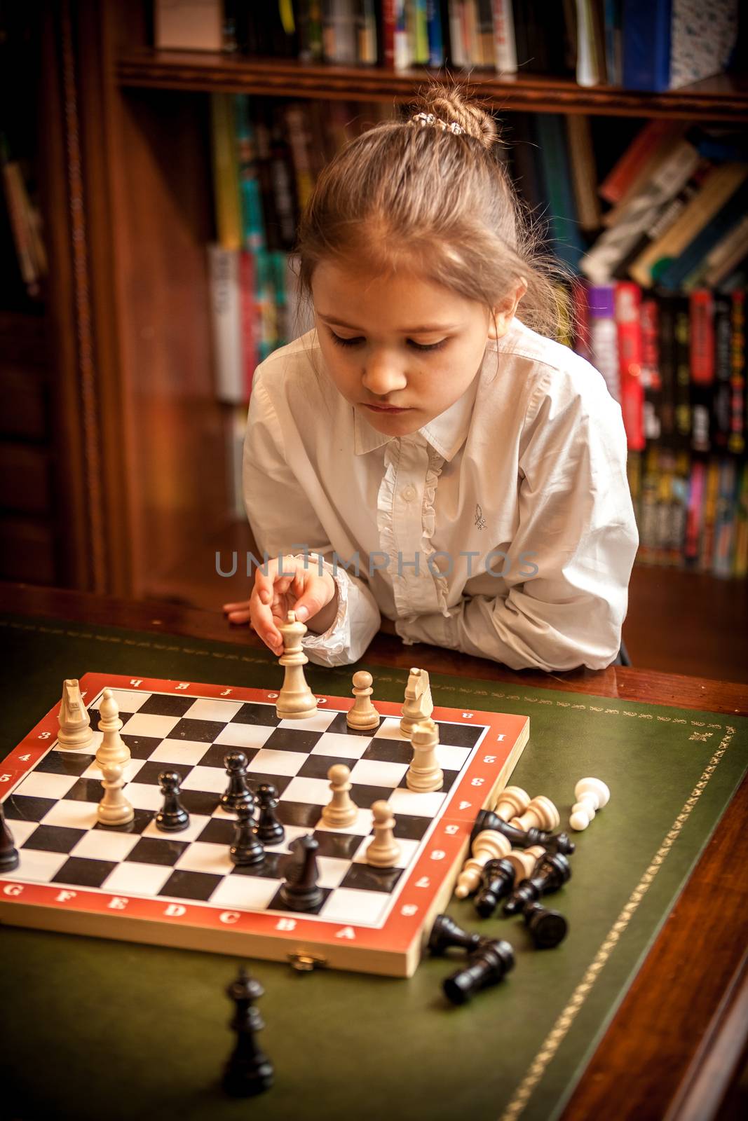 Girl making move on chess board by Kryzhov