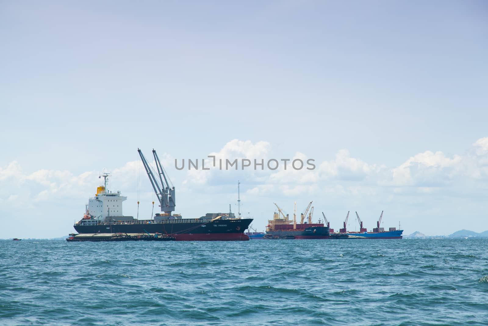 large cargo ship. Moored offshore. Transport near the docks.