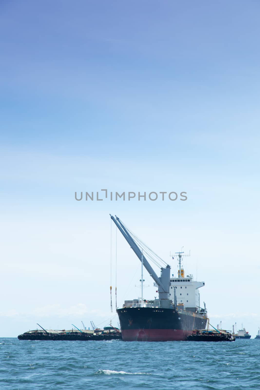 large cargo ship. Moored offshore. Transport near the docks.