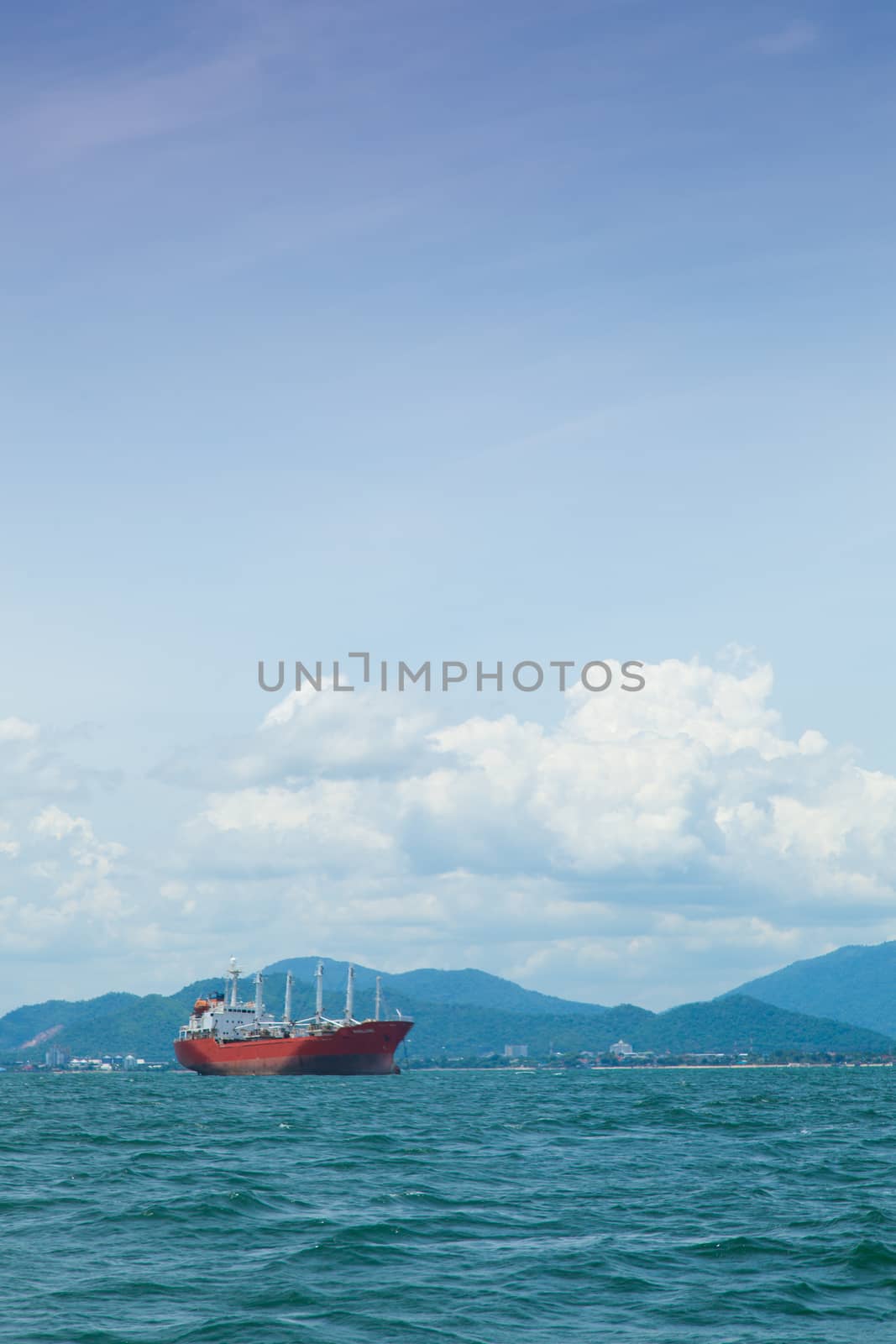 large cargo ship. Moored offshore. Transport near the docks.