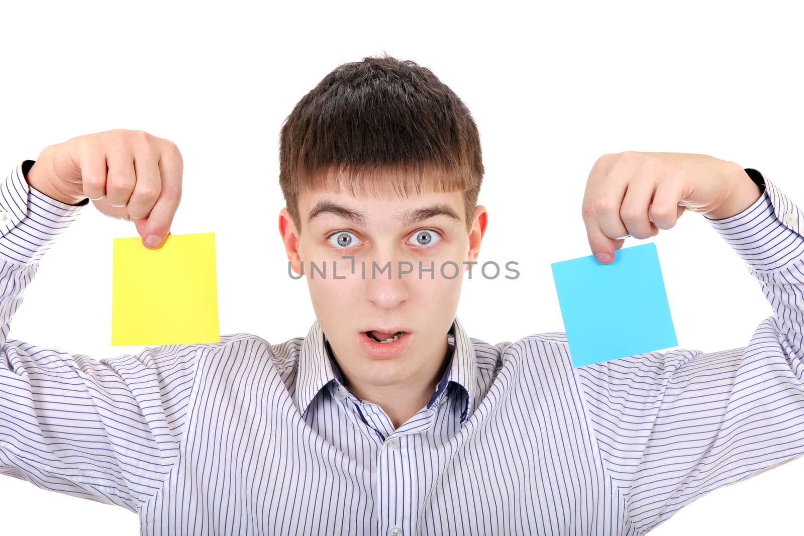 Surprised Teenager with two little Papers Isolated on the White Background