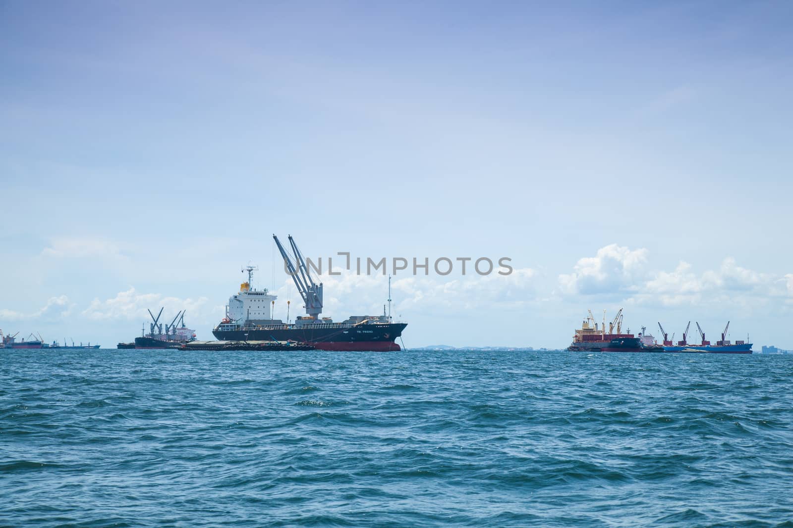 large cargo ship. Moored offshore. Transport near the docks.