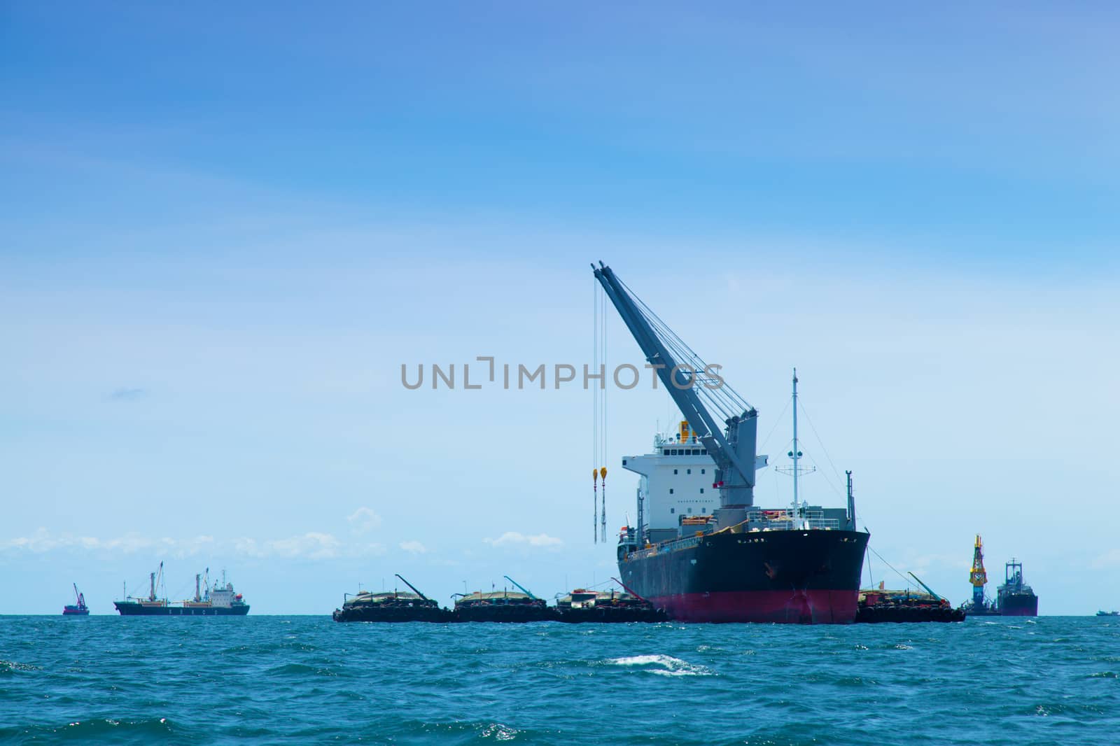 large cargo ship. Moored offshore. Transport near the docks.