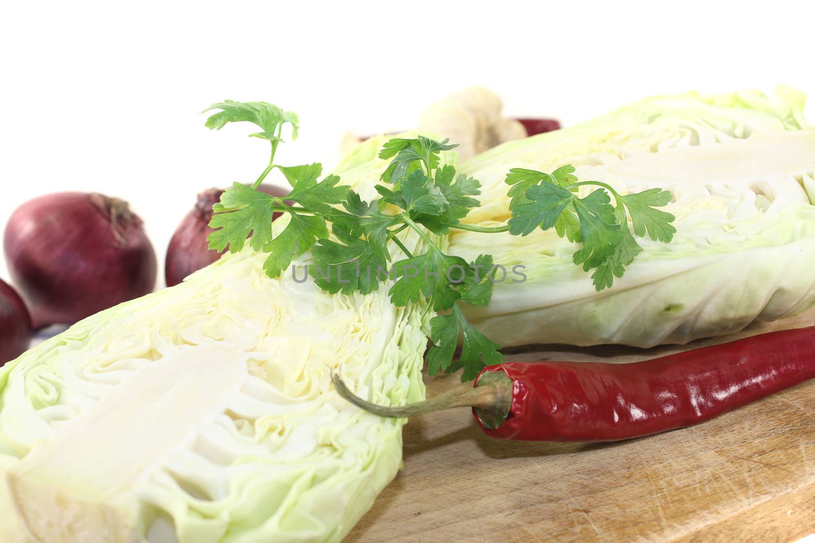 sweetheart Cabbage with hot peppers on a board by discovery