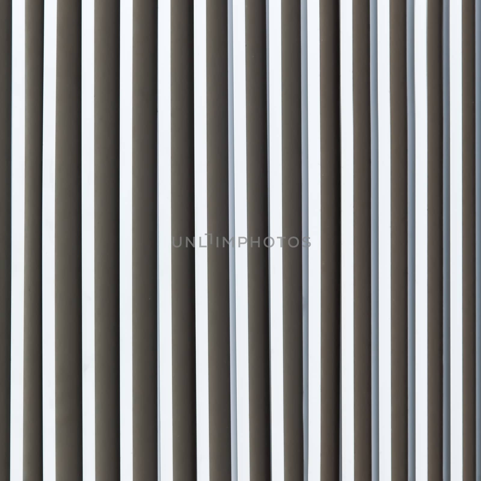 Louver window. Aluminum material as long as the background of the wall.