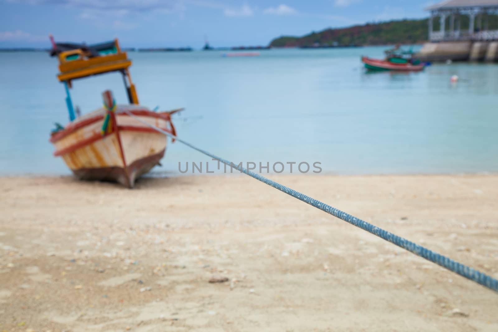 Small fishing boat. Parked on the beach. Ships were made of wood.