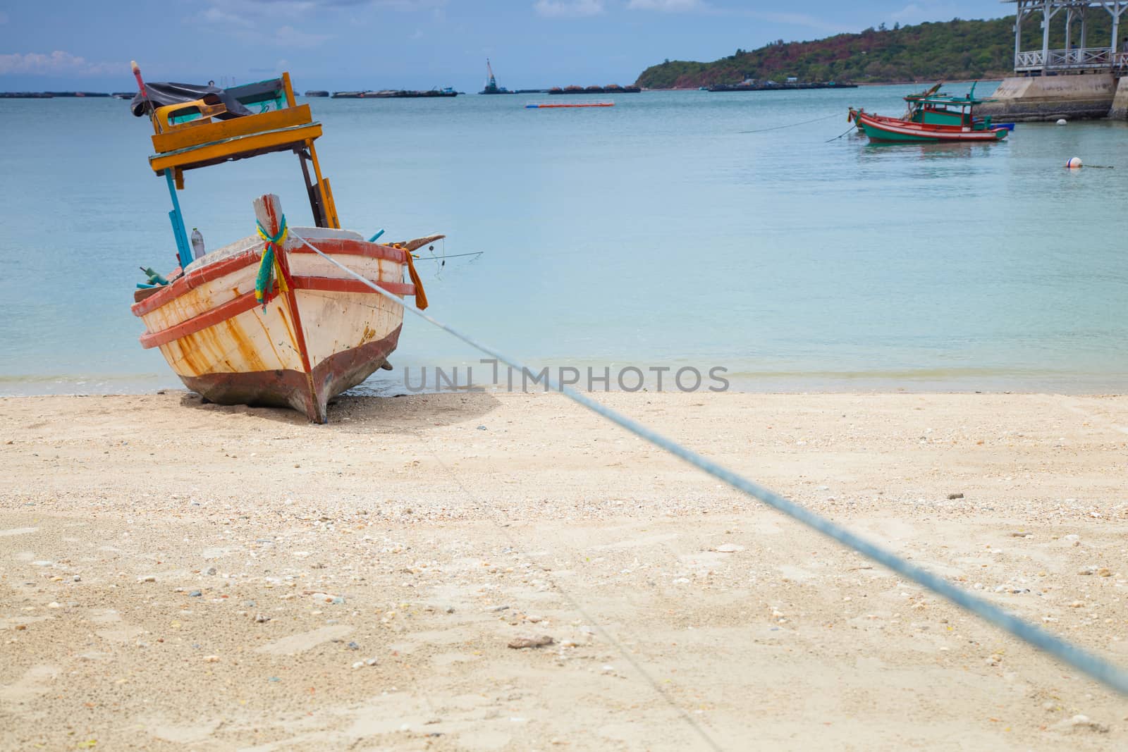 Small fishing boat. Parked on the beach. Ships were made of wood.