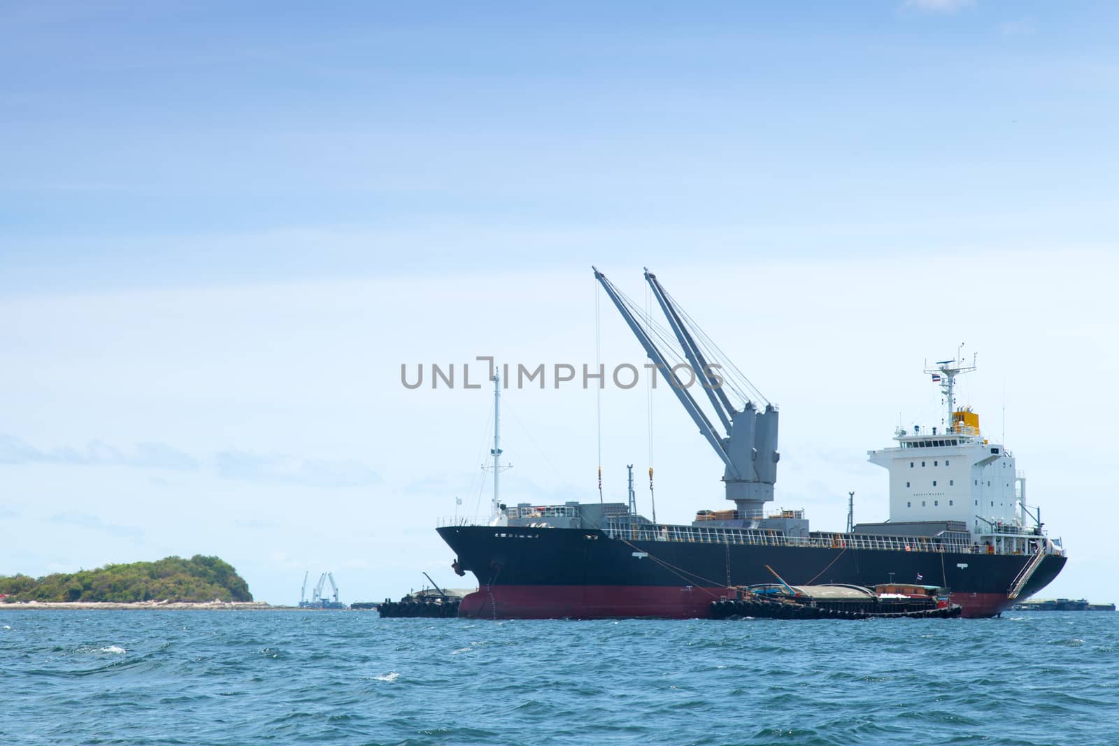 large cargo ship. Moored offshore. Transport near the docks.